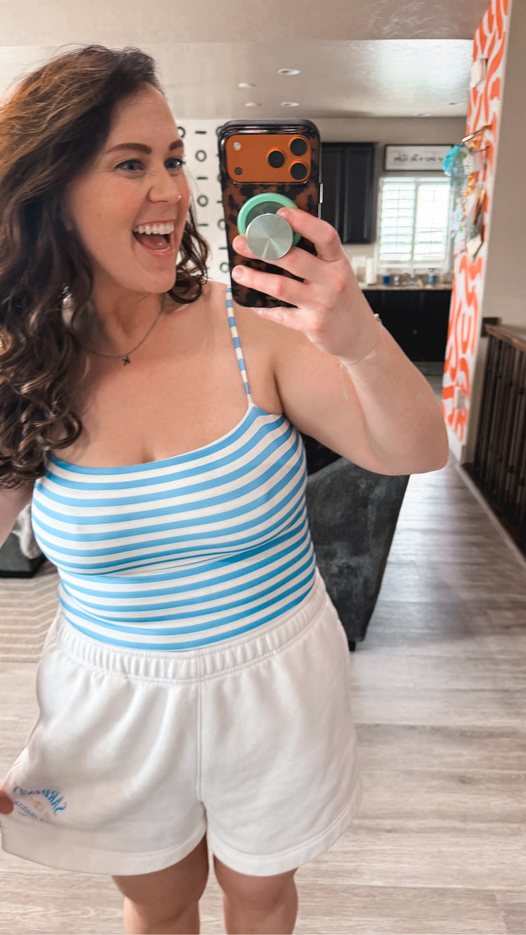 Such a fun tank!!! 🤩 
This is a VERY snug tank, I’m wearing the XL, and it hits at above my belly button I meant to show you that, but obviously got distracted 🫠 
But so stinkin cute for summer layers!! 😍

Also… wear an XL in my shorts 😁

#LTKdayinmylife #LTKMidsize #LTKmomlife