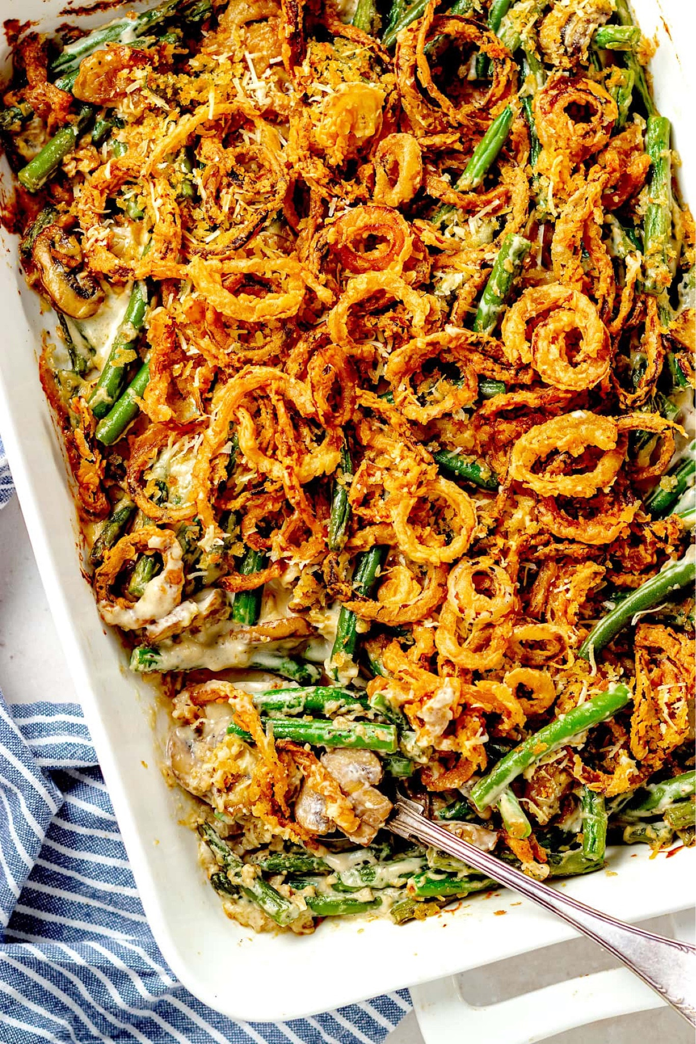 Green Bean Casserole- This classic green bean casserole is the perfect holiday side dish and a Thanksgiving favorite! Tender green beans, homemade creamy mushroom sauce, and crispy fried onions are baked until bubbly! Full recipe on my blog at TwoPeasAndTheirPod.com

#LTKHome #LTKFindsUnder100 #LTKFindsUnder50