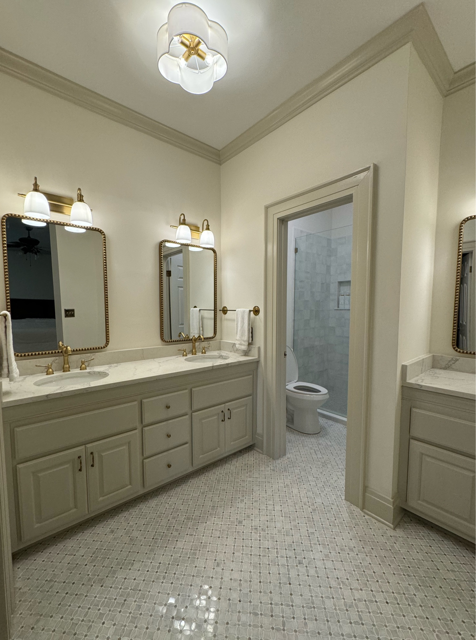 Antique brass fixtures, revere pewter cabinets, Carrara marble tile