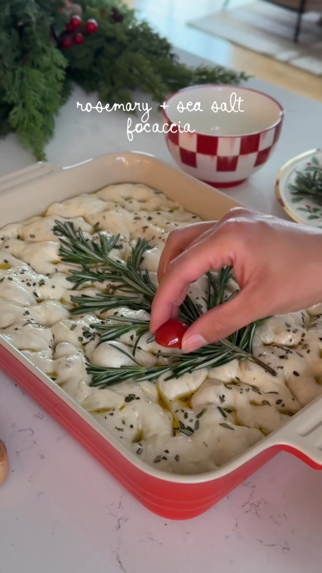 This was my FIRST time EVER making focaccia! 🍞If I can make it this easily, you can too ◡̈ When I started I was just making plain with the tree on top then at the end I decided to add chopped rosemary and flaky sea salt and let me tell you that was the MOVE. My family tried it and also loved it. Such a hit. Highly recommend making focaccia if you wanted to get started in your bread journey. It’s soooo much easier than sourdough so gives you some confidence to keep trying lol. Recipe below ◡̈ Also if you have any recipes you love or tips drop them in the comments!! 

Ingredients
- 2 cups warm water
- 2 1/4 tsp active dry yeast (or 1 packet)
- 2 tsp honey 
- 4 cups all-purpose flour (I’ve heard bread flour is better though?!)
- 2 tsp salt
- ~ 1/4 cup olive oil (and extra for the pan + topping)
- Rosemary sprigs (for tree decor and 1.5 tbs chopped for topping)
- Cut tomatoes for ornaments on tree
- Flaky salt for topping

Directions
- In a large bowl mix warm water, honey & yeast. let it sit until foamy
- Add the flour & salt & stir
- Add 1/4 olive oil and mix again
- Cover bowl and let rise until doubled (I waited 1.5 hours)
- Uncover and transfer to baking dish
- Stretch dough in pan using oiled fingers 
- Cover again and let sit for 30 min
- Uncover and drizzle olive oil all over pan (be generous!!)
- Sprinkle rosemary
- press fingers into dough to create dimples
- Create your tree with rosemary and add tomato ornaments, I also coated the rosemary sprigs with olive oil to try to prevent them from burning in the oven 
- Sprinkle flaky salt 
- Bake for 25 min at 425
- Take out and brush with olive oil
- ENJOY!