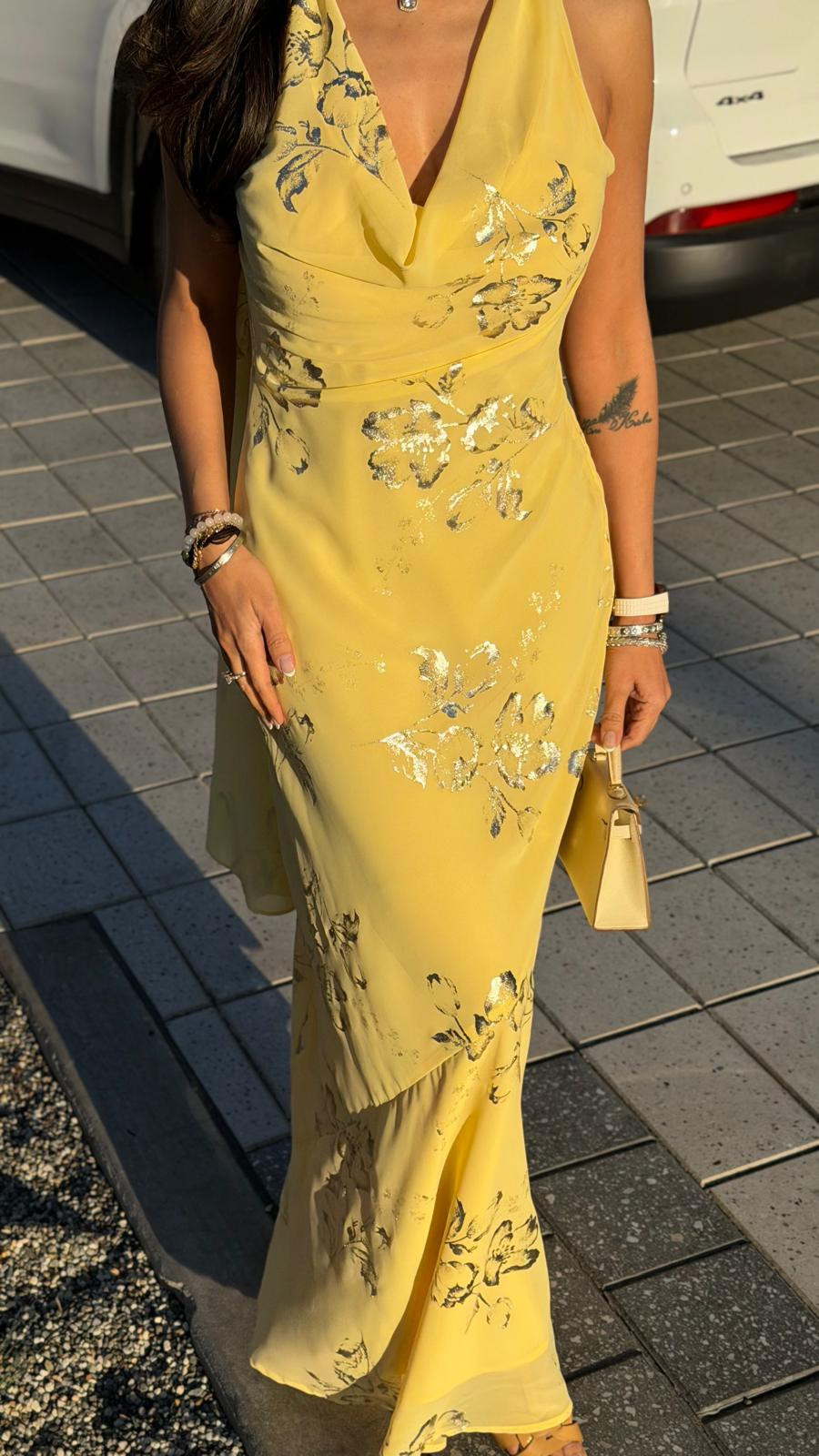 Catching the last light of the day with ocean breezes and stunning city views. There is something completely magical about the way the golden hour sun catches the metallic floral details on this dress. With its elegant draped back and flowy silhouette, it’s the absolute perfect piece for a sunset dinner by the water. 💛 

 #LTKgrwm #LTKSeasonal #LTKSaleAlert