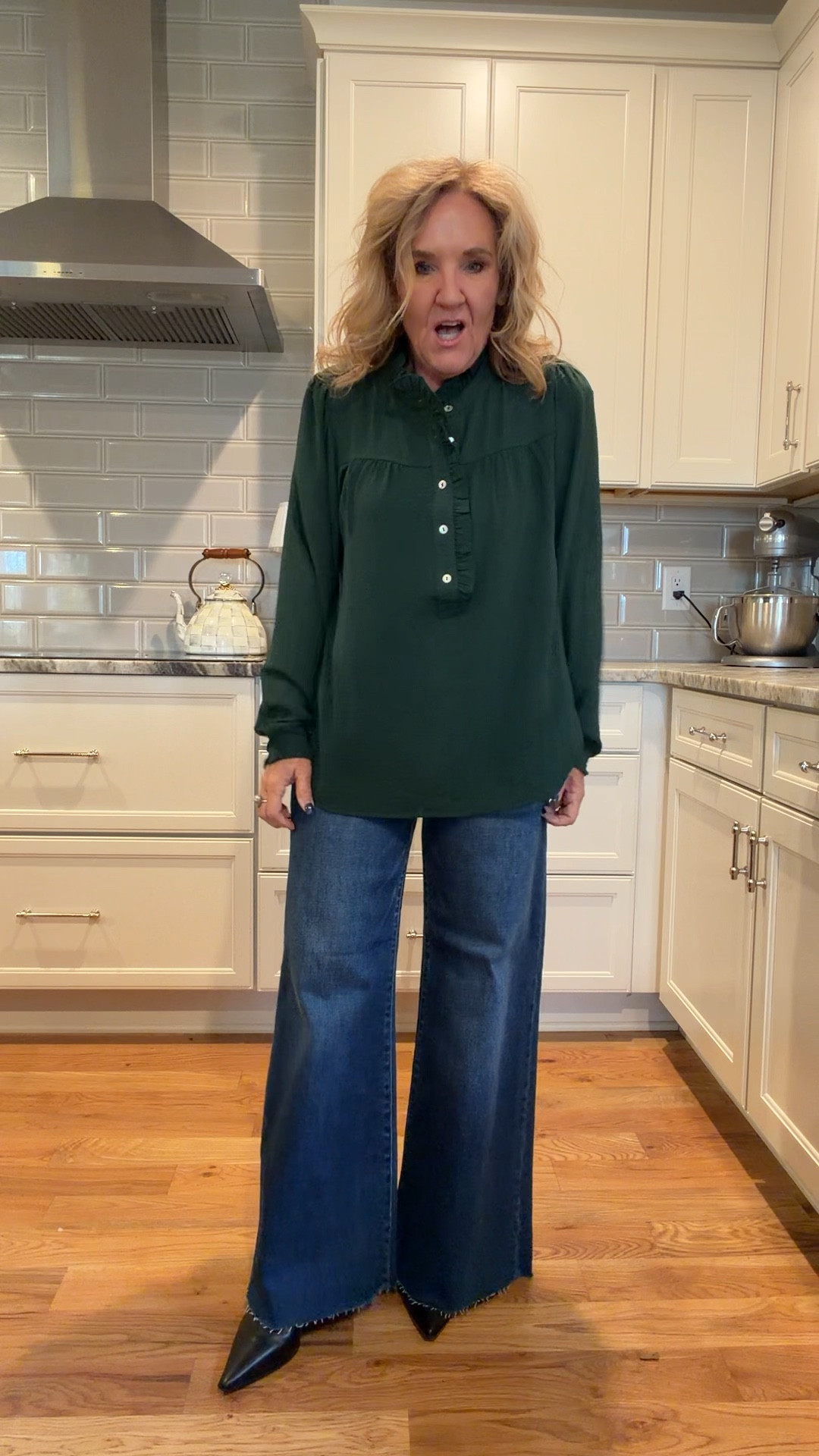 New arrivals from @socialthreads 
Social threads boutique has a wide selection of risen genes which are fan favorites. They are $74. They have a lot of stretch and they’re super flattering. I am wearing a size 29 regular. I love this Palazzo jeans. It also comes in a black wash.

Pretty ruffled trim blouse in Evergreen also comes in a pretty red. They also sent me a great sweater that I’ll link as well.

Pointed toe booty are worth a splurge. I did size up a half for comfort.

Casual holiday outfit, wide leg jeans

#LTKHoliday #LTKOver40 #LTKFindsUnder100