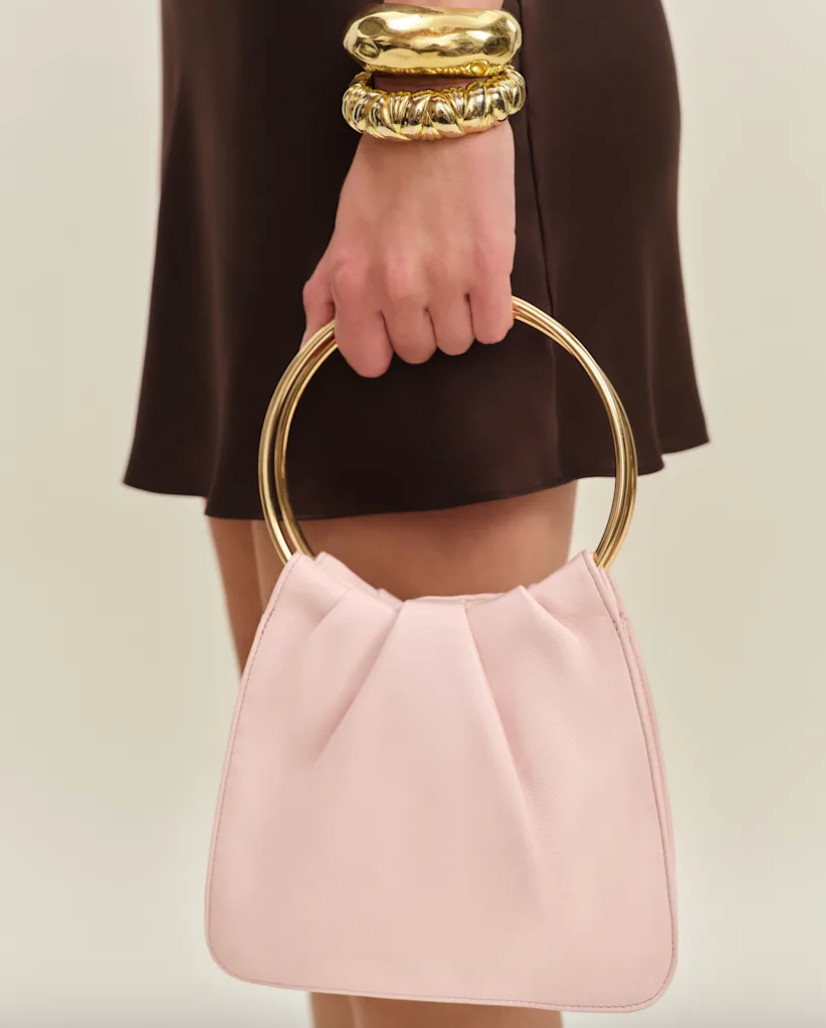 Sweet and sophisticated 🎀 this mini light pink bag is the perfect accessory for day or night, adding a soft touch of color to any look. #PinkBag #LTKStyle #ChicAccessories #EverydayElegance 

 #LTKstyletip #LTKwedding #LTKFashionMonth