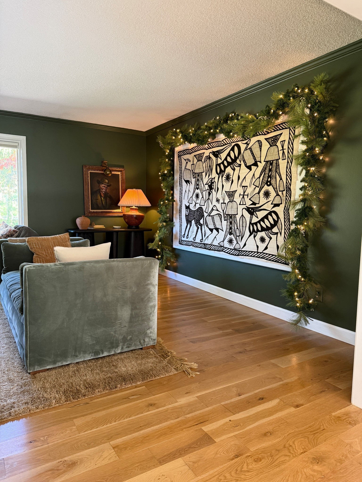 I used (4) Hearth and Hand garlands and (2) lighted 12’ regular garlands to get this look. The Korhogo art is 8’ long and about 5.5’ wide so it’s huge. Simple but pretty Christmas decor in the living room. 

#LTKHome #LTKFindsUnder100 #LTKHoliday