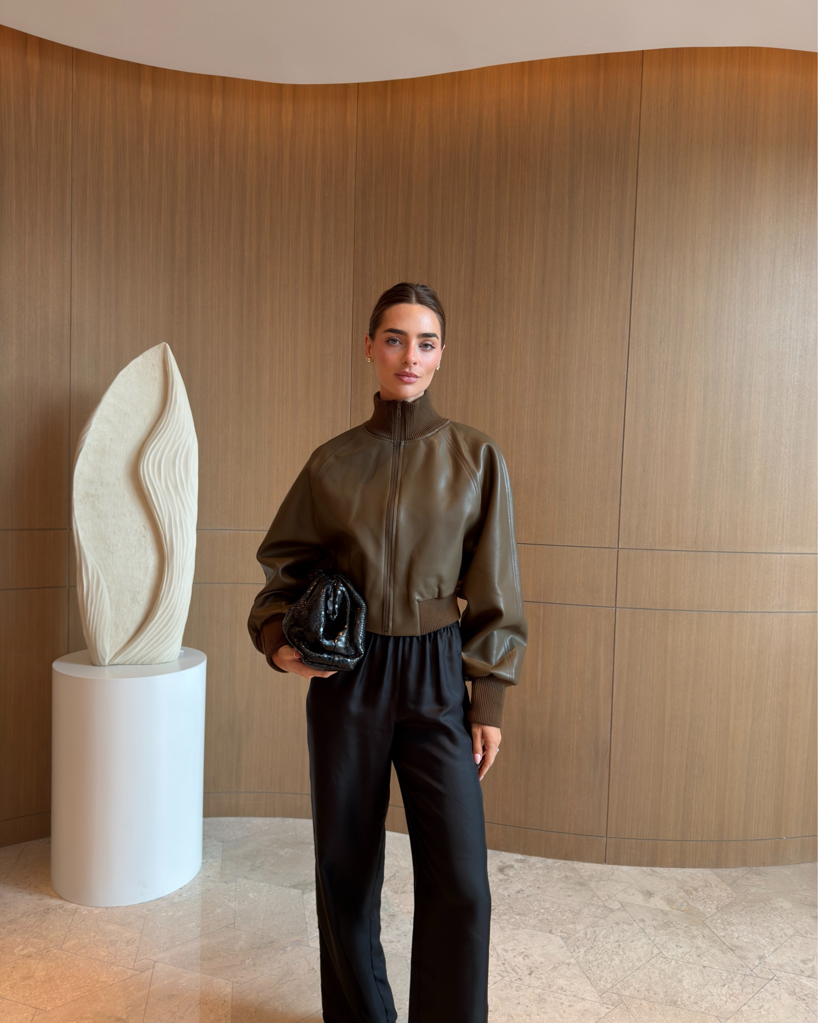 Norma Kamali bomber jacket, silk twill pants, silk trousers, Bottega clutch, pouch bag 

#LTKTall #LTKSeasonal #LTKItBag