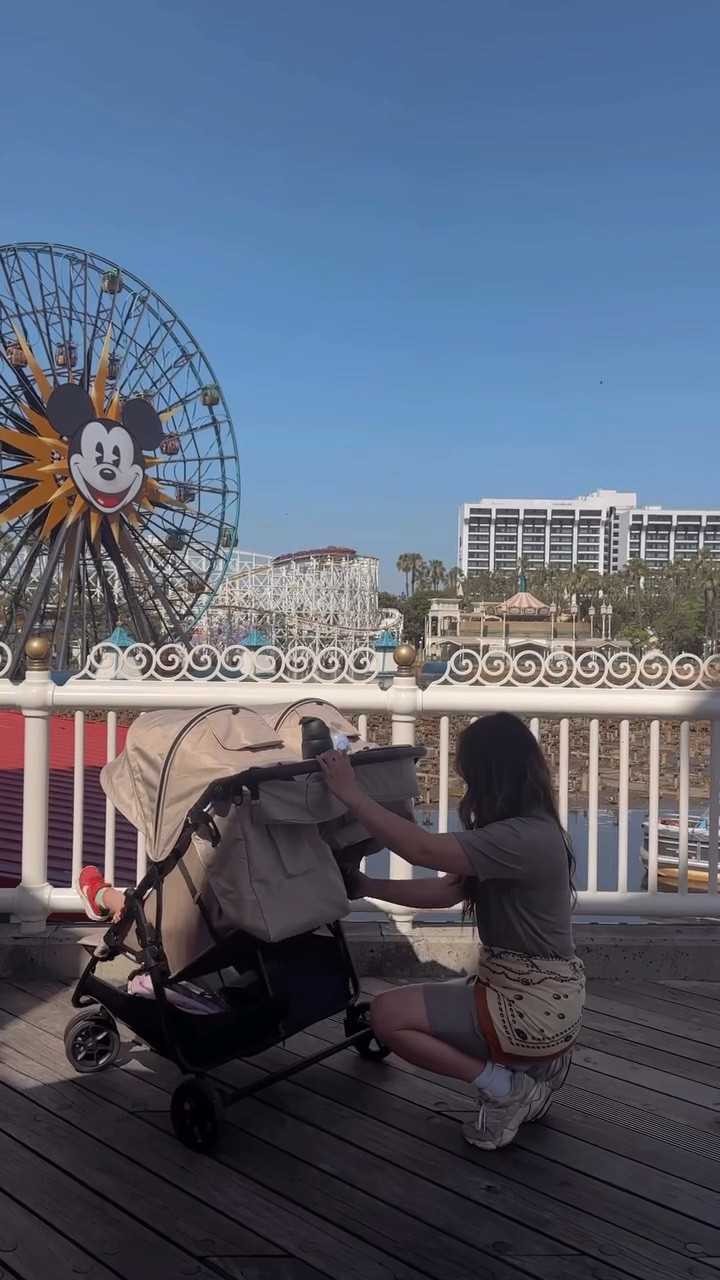 Happy Birthday @Zoe Baby Products @zoestrollers  She is beauty, she is grace, shes the Zoe Twin! ✨ The Twin stroller was pure Disney magic — we truly wouldn’t have made it through our trip without it. Never thought I’d become a double stroller mom, but it became the star accessory of our @disneyland trip. You guys, the girls napped in it every 👏 single 👏 day thanks to the recline and extra-wide shades, and the storage + pockets carried basically our whole life for long days in the park. It was so easy to maneuver and honestly made those long Disney days feel fun instead of exhausting. I can’t believe I almost convinced myself we didn’t need a stroller — we wouldn’t have had such a magical time without it ✨ love you @zoestrollers !! 🍊