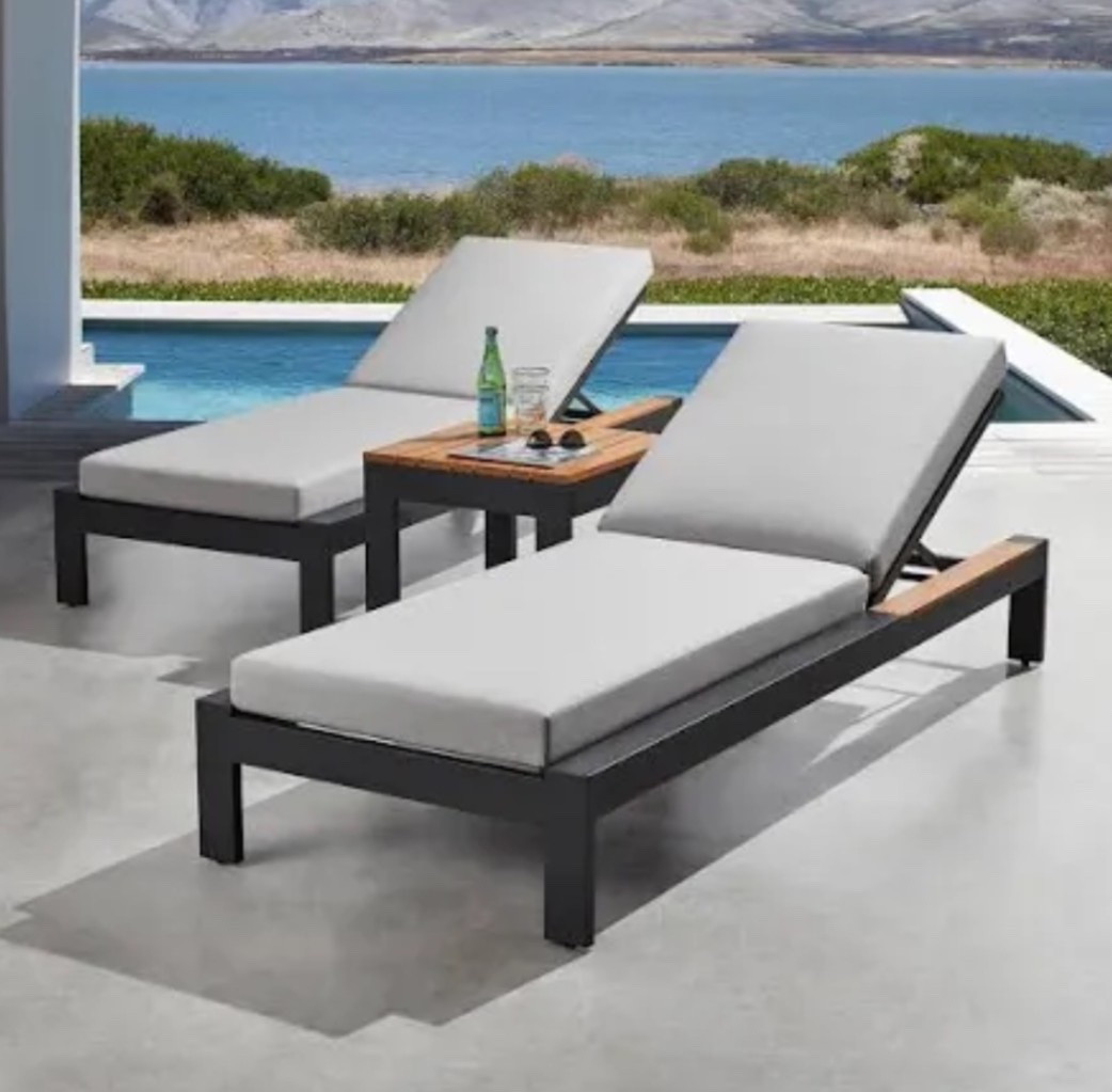 Shop these stunning teak and black chaise lounge chairs. 