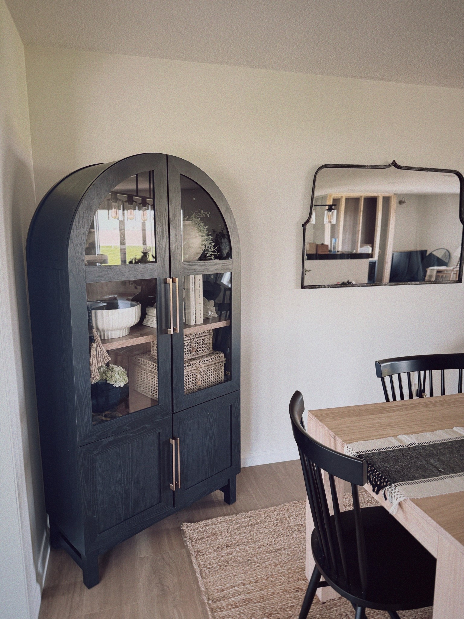 Still not over this arched cabinet 🖤 It’s one of my favorite pieces to style and gives such a high-end look without the splurge. I filled it with neutral bowls, baskets, greenery, and a few favorite textures.

Everything inside — plus similar cabinet options — are linked

#LTKhome #cabinetstyling #archedcabinet #neutraldecor #LTKdecor #storageinspo #homestyling #modernfarmhouse #LTKfinds #organizedandpretty #diningroomstyle #blackcabinet