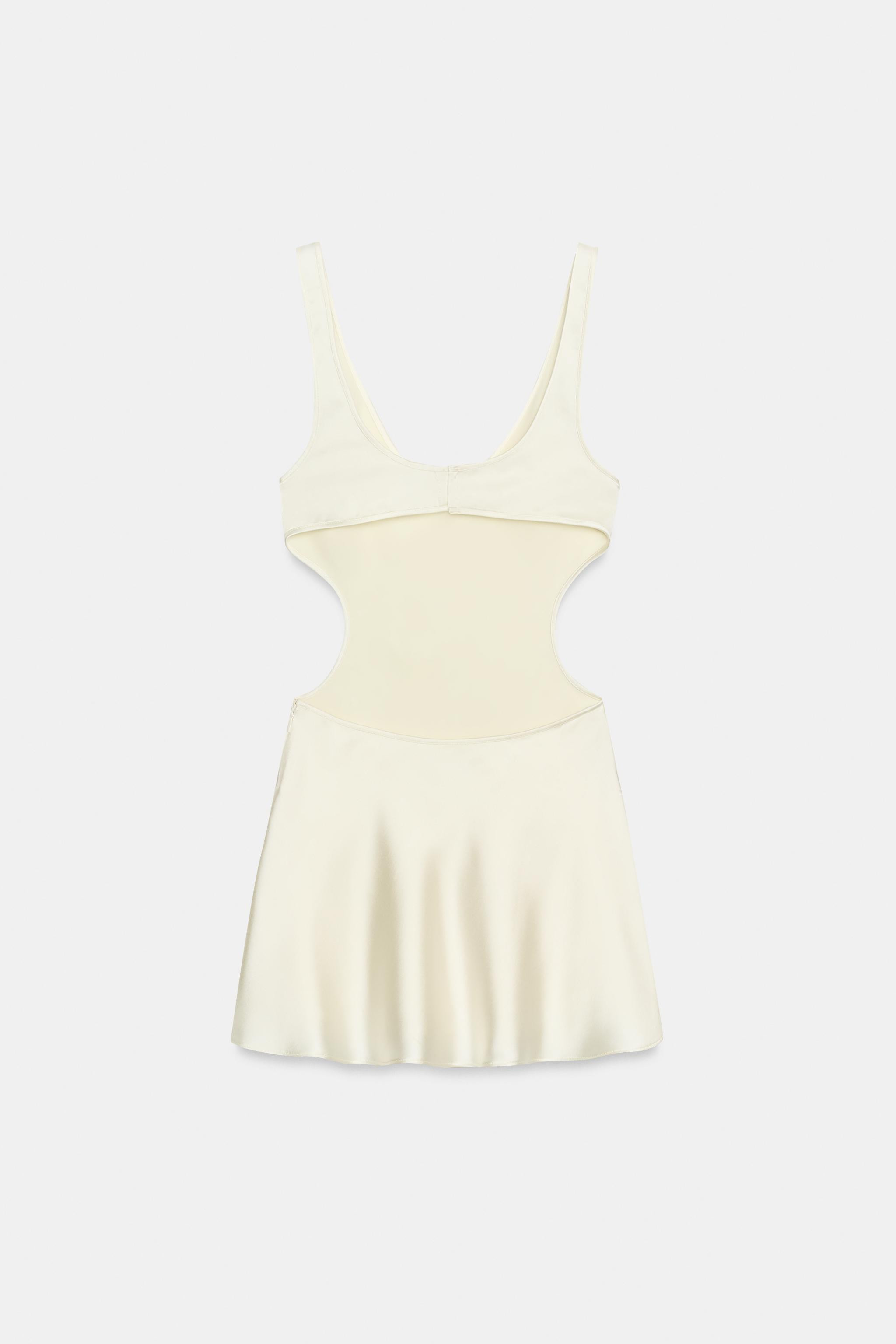Short dress made of satin fabric. Round neckline and straps. Side cutout details. Back closure wi... | Zara US