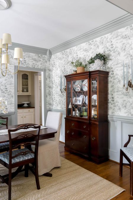 My dining room china cabinet, table, and rug complement the vintage wallpaper. Dining room decor  

#LTKhome