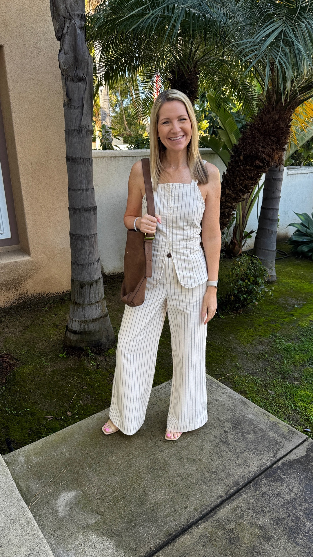 Friday Finds! Since transitioning to work from home life, it’s rare that I buy office wear but I have been needing some new trouser pants. I came across this pinstriped linen blend pair from Target and love the wide leg style. 

This matching button down sleeveless vest opens right at the top of the pants and has an adjustable tie waist. 

The quality of this set is so good. Plus I love that I can wear these separately too. 

#LTKSeasonal #LTKfindsunder50 #LTKworkwear