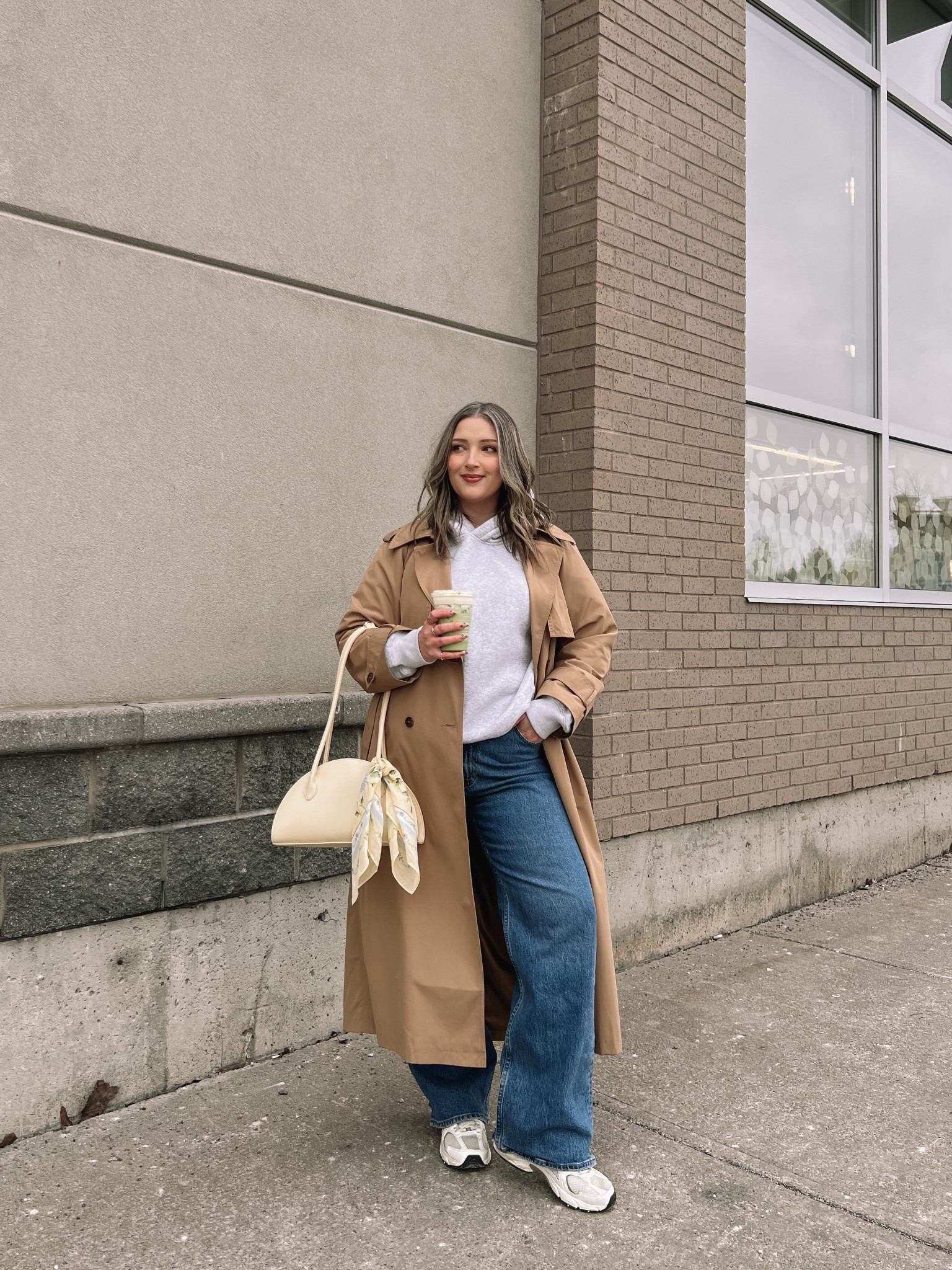 Spring outfit for a chilly day! Wearing my usual size L in the classic water resistant trench coat. Hoodie runs small, sized up to XL. Wearing 32 in the jeans, could have done 31 but I like a looser fit. New Balance sneakers are so comfy but run big, I’m a 9.5-10 and wear a 9. Butter yellow bag and scarf are Old Navy, Canadian links under similar products.

#LTKmidsize #LTKsale #LTKjeans