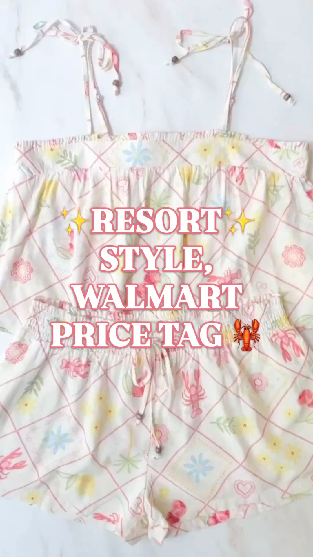Walmart vacation outfit, Walmart matching set, beach vacation outfit, resort wear women, summer matching set, women’s shorts set, spring break outfit, vacation outfits beach, coastal outfit women, cute summer outfit

This Walmart vacation set is giving full resort energy with a very friendly price tag.

The print is the reason it stops you — soft coastal colors, lobster details, seashells, little summer motifs, and that easy vacation feel that looks like something you would pack for a beach trip, resort weekend, cruise, lake house, or spring break getaway.

The top and shorts are sold separately, which is actually smart because you can mix sizes and wear them together or separately. The top has adjustable tie straps, ruffle trim, a straight neckline, a smocked back inset, and an easy swing shape. The shorts have an elastic waist, tie front, side pockets, and a relaxed pull-on fit.

Fabric is 55% cotton and 45% rayon, so it has that lightweight woven feel you want for warm weather, vacation packing, lounging, beach days, poolside mornings, casual dinners, and throwing on over a swimsuit.

Why this set works:
✨ Walmart price tag
✨ matching shorts set
✨ coastal lobster print
✨ adjustable tie straps
✨ elastic waist shorts
✨ side pockets
✨ lightweight woven fabric
✨ easy vacation outfit
✨ mix and match pieces
✨ sizes XS-XXXL

Wear it with sandals, a straw tote, gold hoops, a swimsuit underneath, or pack it as an easy beach vacation outfit you can wear on repeat.

Walmart matching set, Walmart summer outfit, Walmart vacation outfit, Walmart fashion finds, vacation outfits beach, beach vacation outfit women, resort wear women, summer matching set women, women’s shorts set, cute summer outfit, spring break outfit, coastal outfit women, lobster print outfit, beach outfit women, cruise outfit women, poolside outfit, swimsuit cover up outfit, casual summer outfit, warm weather outfit, Walmart shorts, tie strap top, pull on shorts, cotton rayon set

#LTKFindsUnder50 #MatchingSet

#LTKSeasonal #LTKTravel #LTKSwim