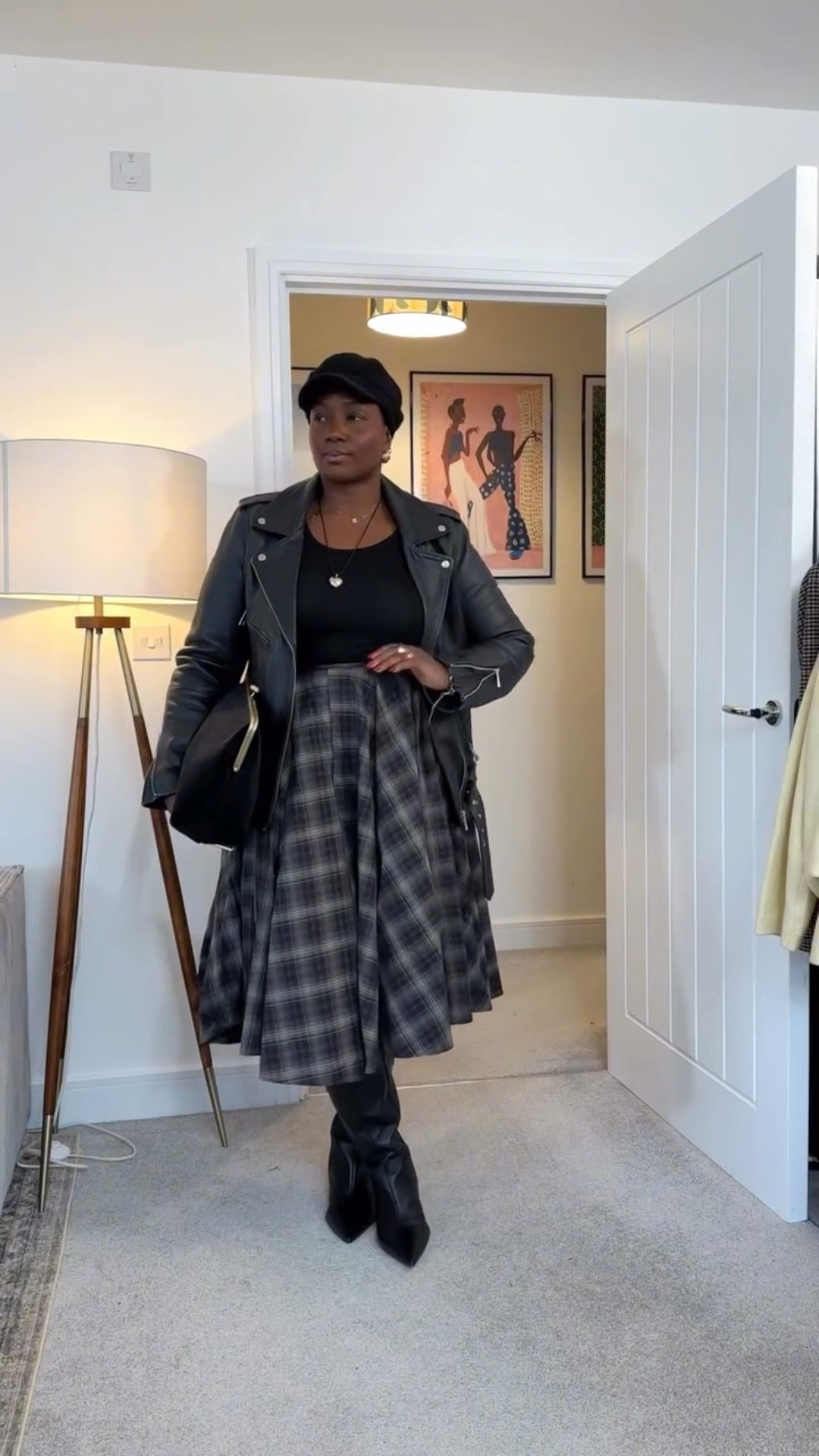Midsize outfit for curvy women showing how to style a checked skirt with a leather as a 40 something outfit repeater. 

#size16style #over40styleblogger #ootdblackwomen #checkskirt #bikerjacket 

midsize fashion, midsize style, over 40 fashion, over 40 style, grown woman style, age-confident fashion, Black woman style, Black women fashion, melanated style, brown skin fashion, body-confident fashion, curvy midsize style, real body fashion, chic everyday style, effortless chic, timeless style, polished casual, elevated everyday wear, classic with a modern twist, confident woman style, fashion over 40, style at any age