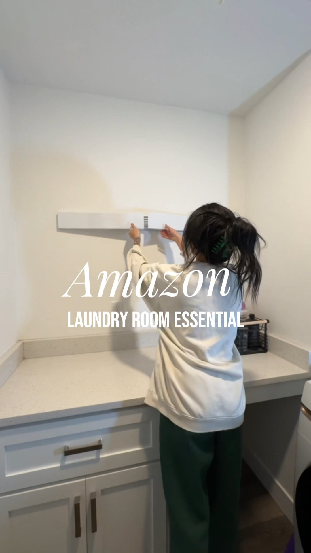 This wall mounted drying rack is a life saver for small laundry spaces! It’s an Amazon laundry essential! #laundry #laundryhack #dryingrack #amazonfinds 