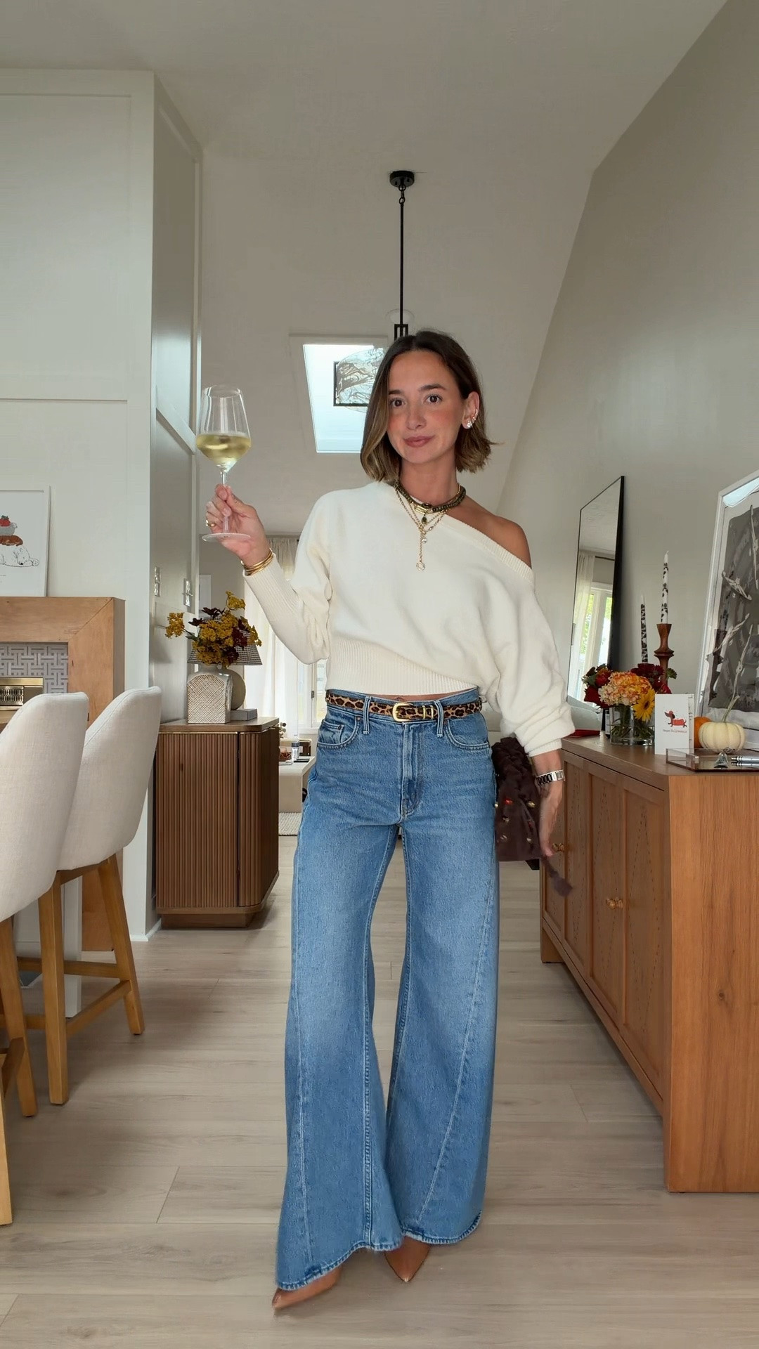 Date night! Small sweater 24 petite jeans. Pouch is old Veronica Beard🤎