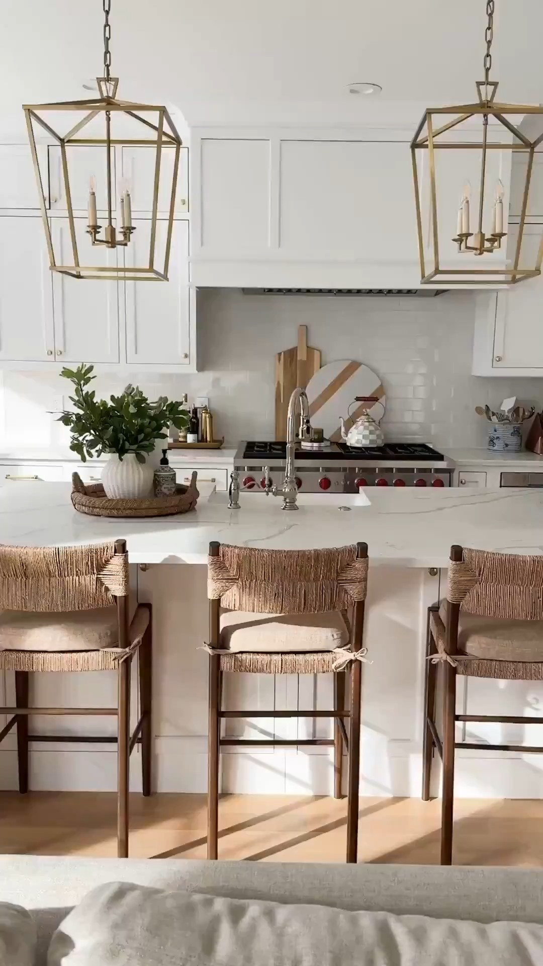 All white kitchen with warm accents and woven counter stools. Modern coastal kitchen design.

#LTKFindsUnder50 #LTKFindsUnder100 #LTKHome