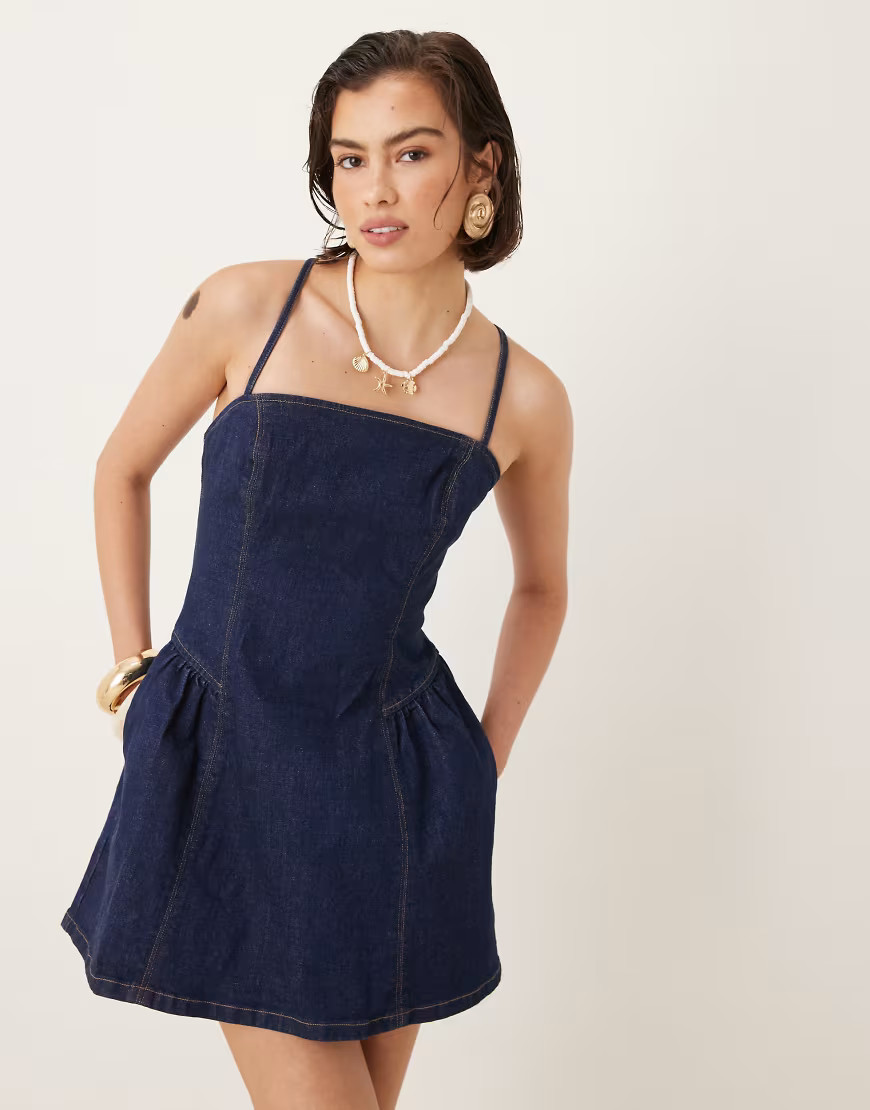 Abercrombie & Fitch dipped waist cross-back denim mini dress in indigo wash-Blue | ASOS (Global)