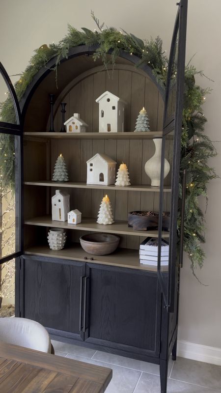 I love these little white houses! One of my favorite things to set up for the holidays. 

Pottery barn, house, Christmas house, arched cabinet, Hattie cabinet, black cabinet, Christmas tree candle 

#LTKHoliday #LTKhome #LTKCyberWeek