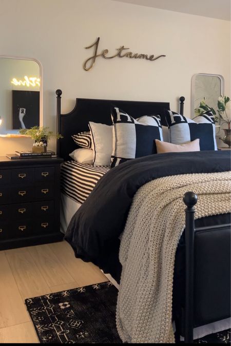 Guest bedroom decor 
Black duvet 
Black upholstered bed 
Gold mirror 
Faux plant 
Black rug 
Black nightstands 
#meandmrjones 

#LTKunder50 #LTKunder100 #LTKhome