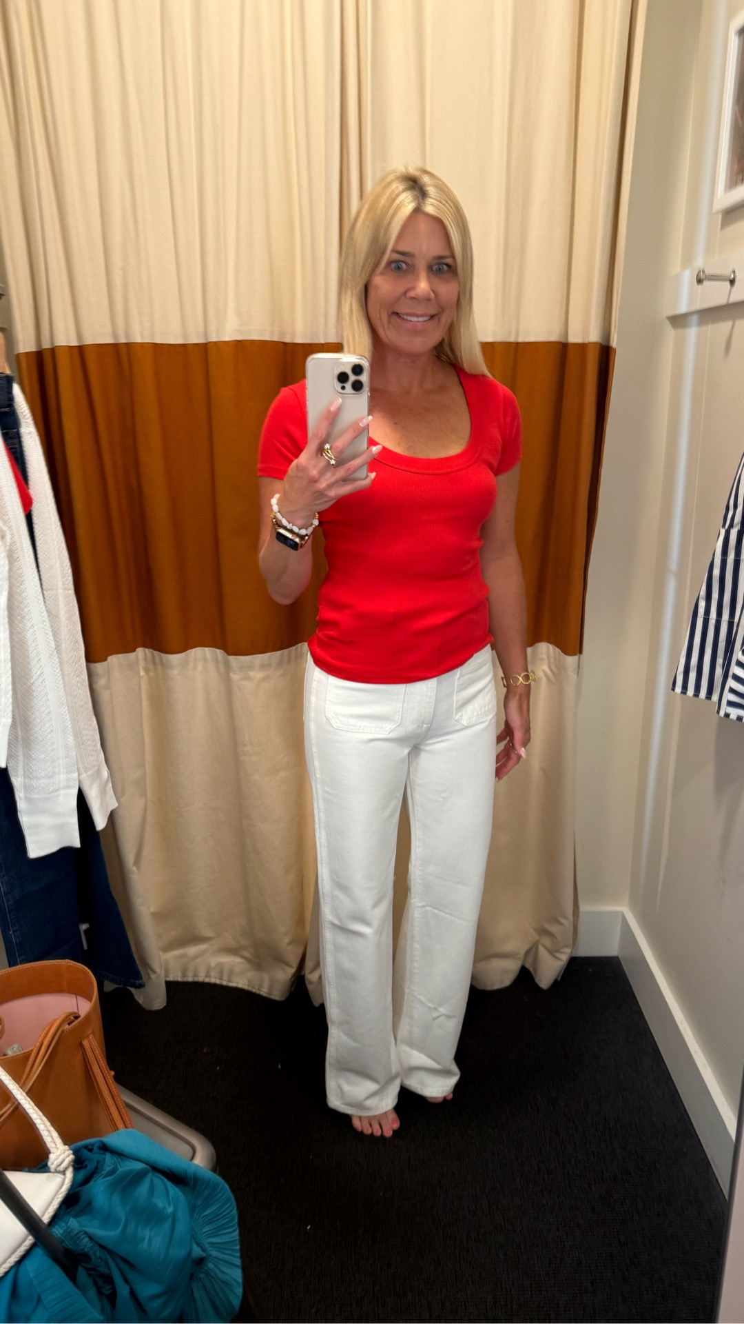 Casual yet stylish outfit to wear for game watching (tee comes in many colors) to support your football team pairing this scoop neck fitted tee with white straight leg jeans with front pockets) or the blue jean version pair. 🏈 Fits true to size. Wearing size S t-shirt and size 25 jeans.

#LTKOver40 #LTKxMadewell #LTKSeasonal