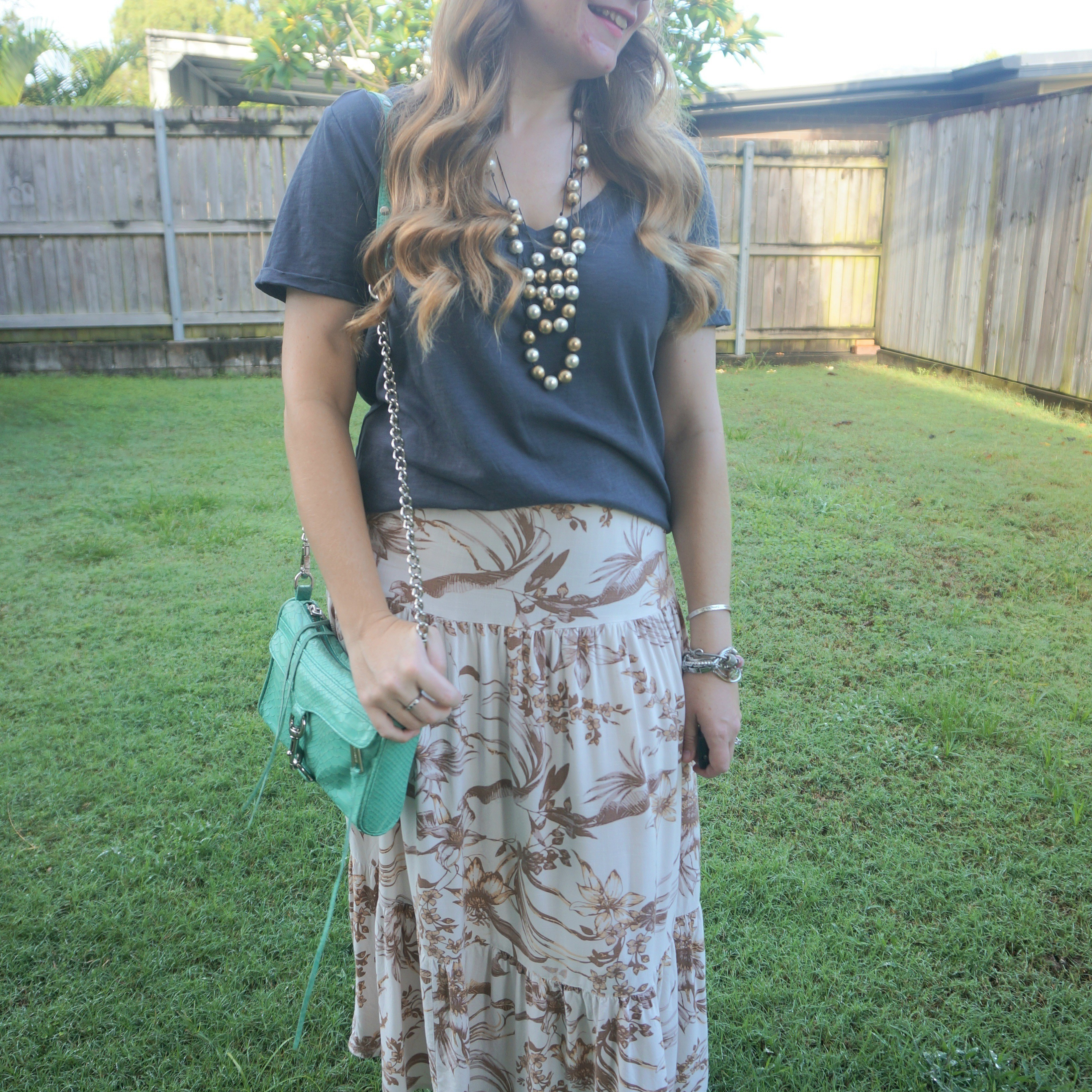 Such a pretty brown floral maxi skirt I got for Christmas with the grey tee I also got for Christmas, and my little aqua mini MAC bag 💙

#LTKbag #LTKaustralia #LTKsummer