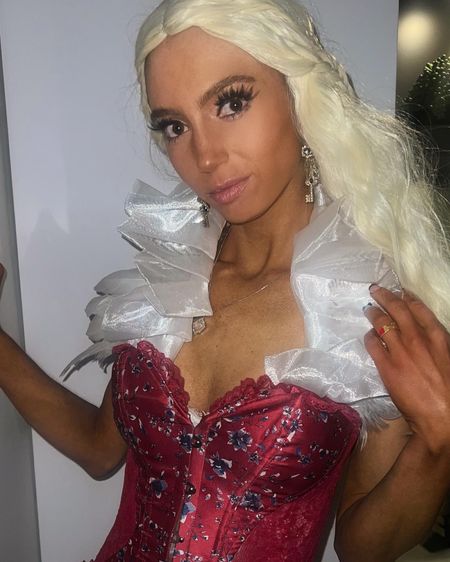 🐉💥Princess of Dragonstone 💥🐉 Princess Rhaenyra Targaryen *with brown eyes + a spray tan* 
Pat decided not to be the Uncle I marry lol I also admit I have only seen 2 episodes and have not watched #got 

Although part of my costume did not arrive on time still pulled it together with an @adoreme corset ♥️ and @kendrascott necklace from @beedurst ✨ 

LuxuryMegg | Megan Quist | House of the Dragon | Amazon Fashion | Adore Me Corset | GOT Costume | Halloween Aesthetic | Medival Costume | Princess Costume | ShopLTK | LTKStyleTip | Blonde Wig | Costume Ideas | Pintrest Halloween | Gothic Feather Shrug | Dragon House 

In need of a corset? ⭐️Use CODE: 'luxurymegg19' to get your first VIP set (2 pieces of your choice)  for just $19.99 with Adore Me! Luxury Megg #amazonfashion #houseofthedragon #halloweenchic  #pinteresthalloween #etsyhalloween #ltkhalloween #fallstyle #halloweencostumeideas #spookyseason #adoremepartner #princessofdragonstone #RhaenyraTargaryencostume #glamnetic #halloweenpartyplanning #corsetstyle #coloredfrenchtips 

#LTKSeasonal #LTKbeauty #LTKHalloween