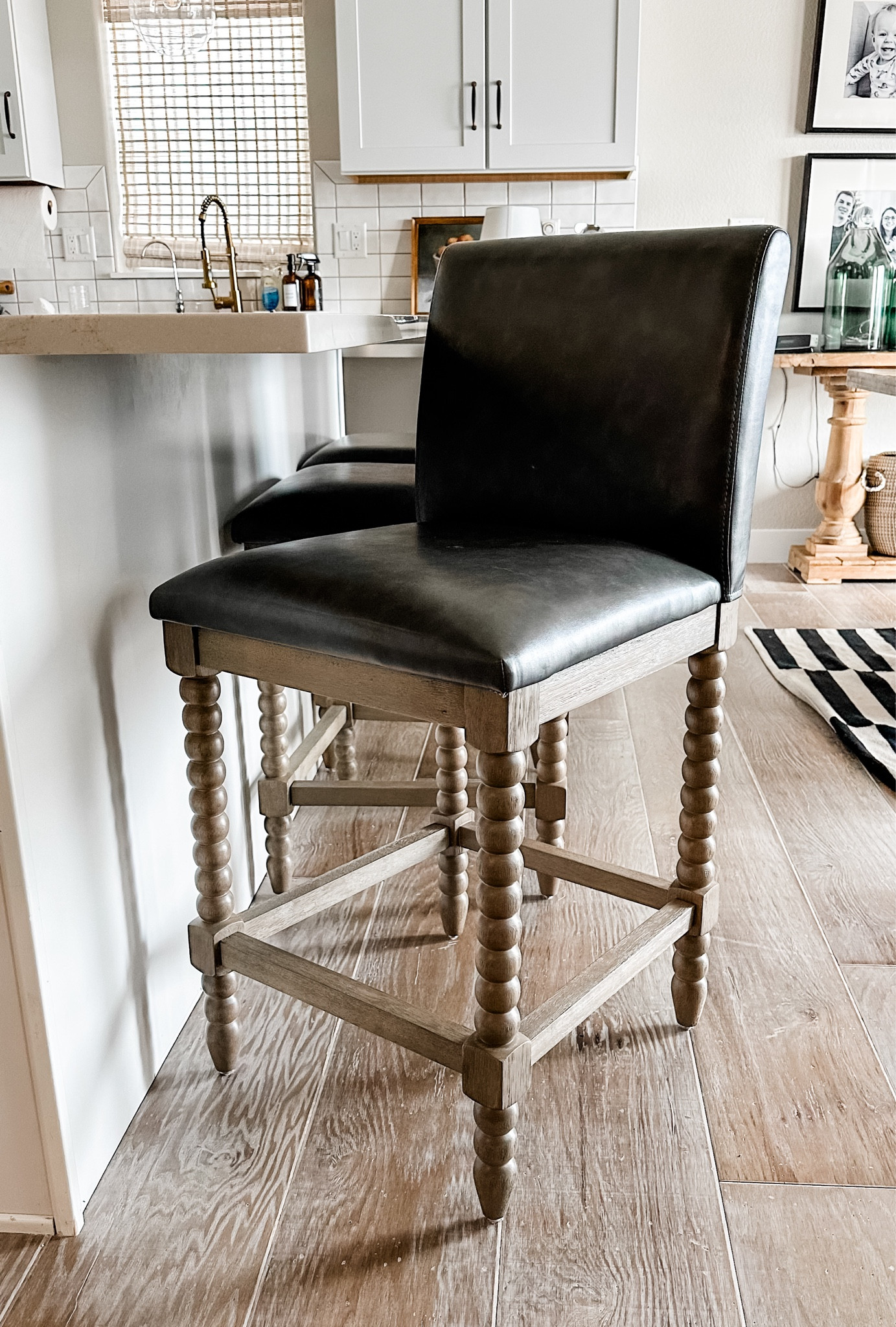 Affordable Leather counter stools under $200 wood and leather with spindle legs. Gray leather and natural wood legs. 60% off clearance Pottery Barn inspired counter stools barstools. Rustic farmhouse organic modern. Dupe dupes more affordable option find replica copy cat similar look for less budget friendly affordable cheap cheaper beautiful pretty sale

Color is best represented in pics 2 &3. Leather is solid dark gray and legs are light wood

#LTKhome #LTKMostLoved