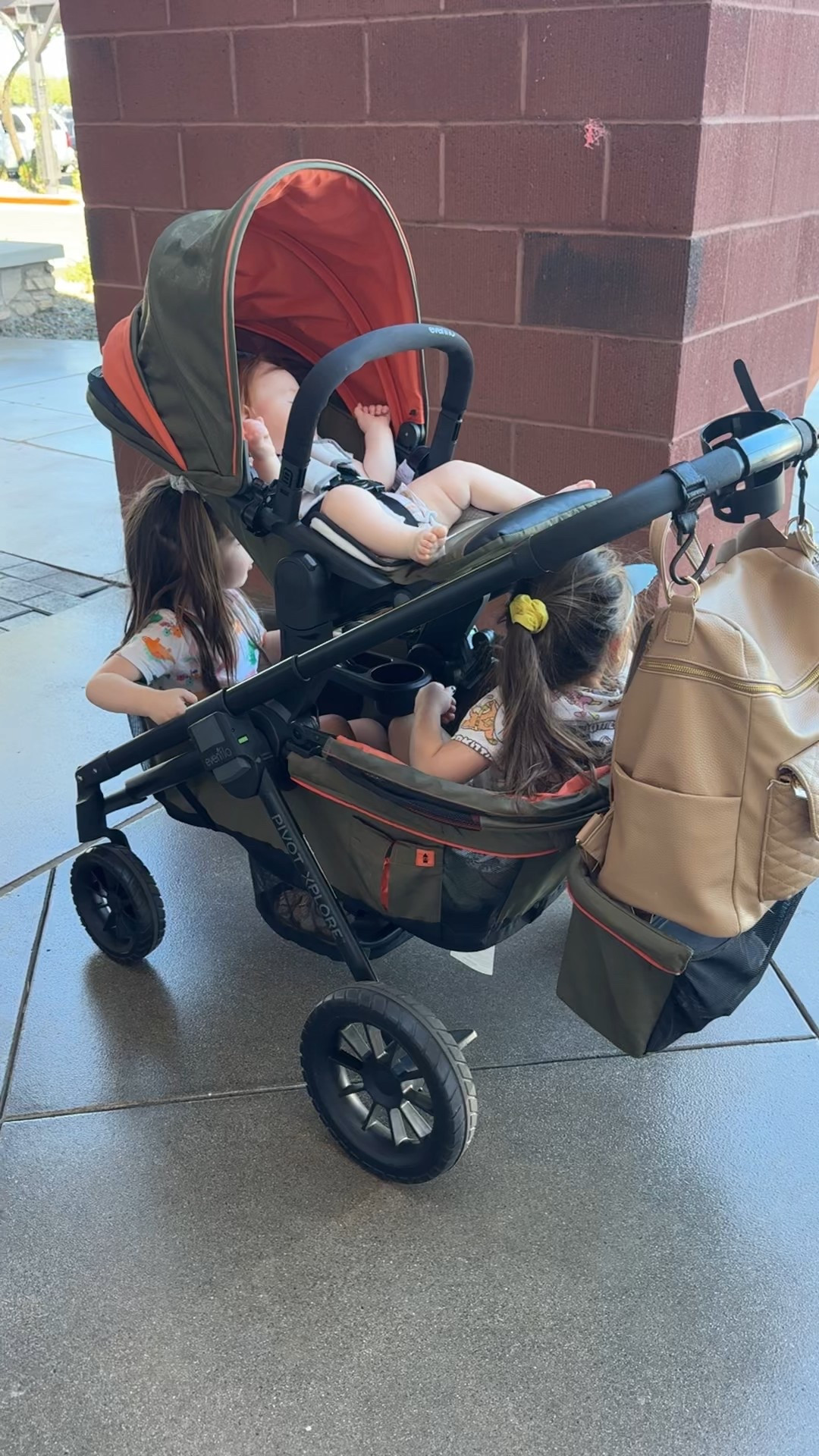 The only way I can get out and about with all 3 littles is by using my Evenflo Xplore wagon with the toddler seat attachment 