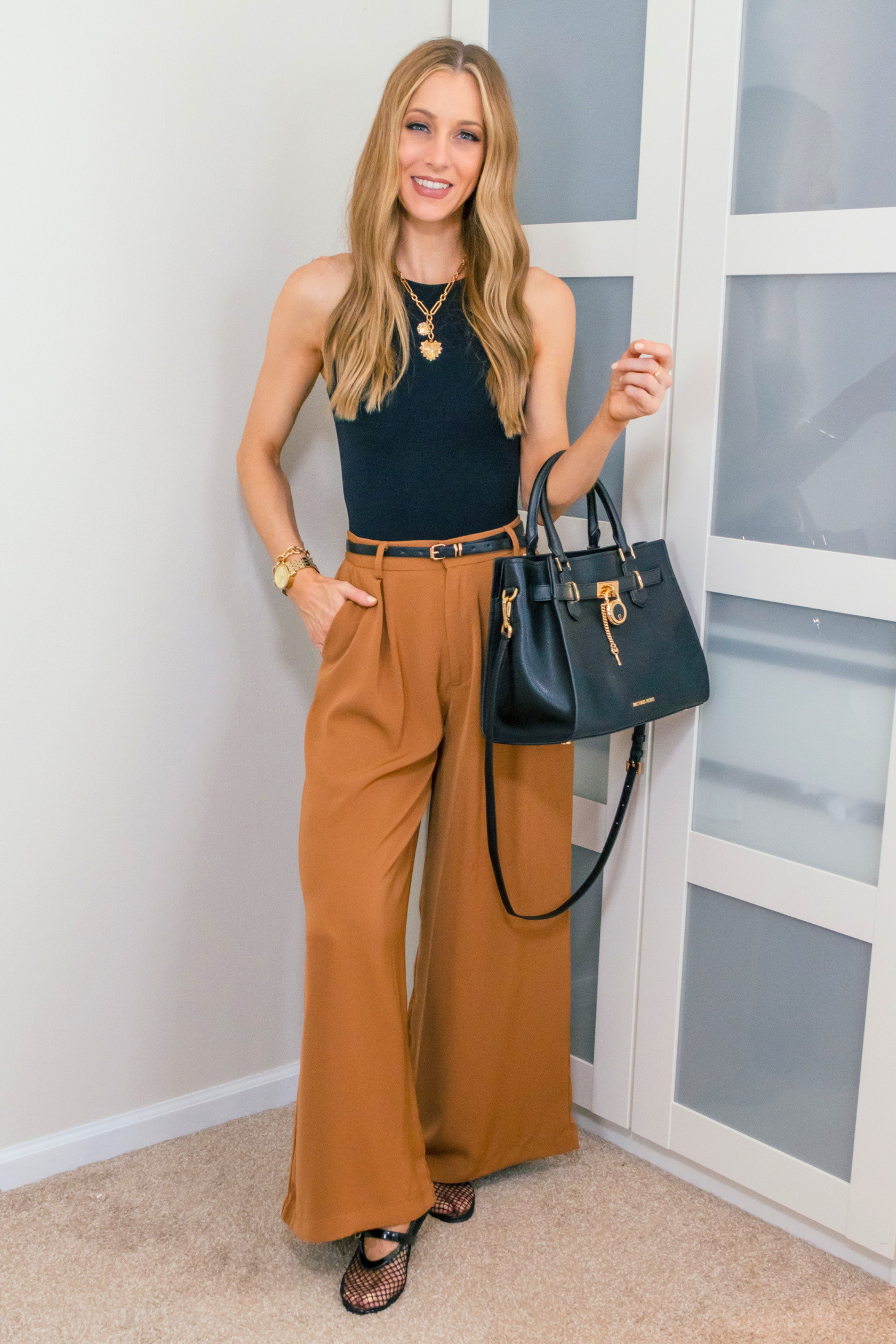 I'm loving this comfy yet chic outfit! These wide-leg pants and a simple bodysuit are perfect for a casual day out. Paired with a crossbody bag and some stylish flats, it's both comfortable and stylish. I'm in a size small in both the bodysuit and the pants. Wearing the brown color in the pants.
Check out my storefront for more affordable fashion finds! 
 

 #LTKootd #LTKOver40 #LTKSaleAlert