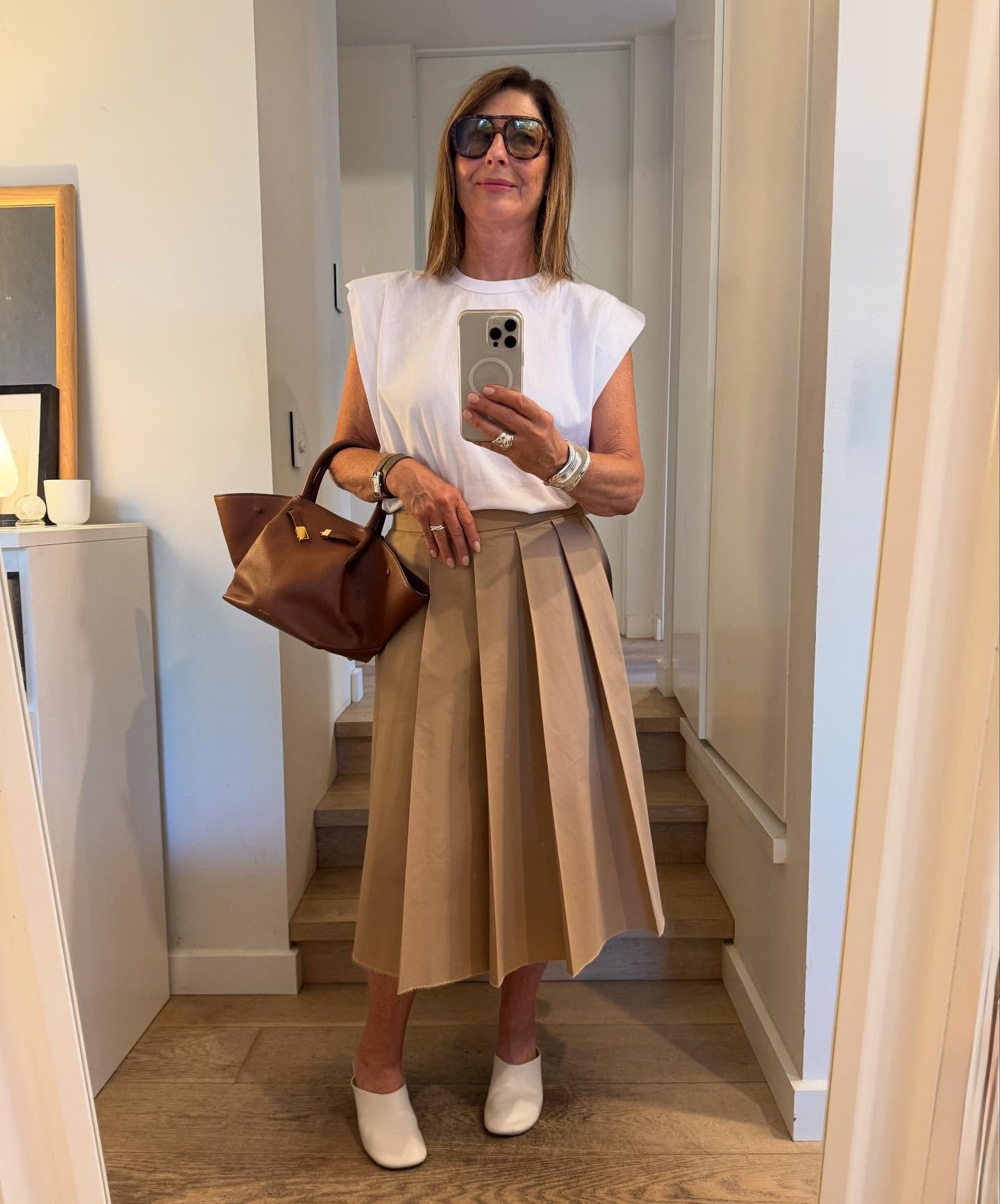 Two things to instantly joosh your wardrobe: 
A white shoulder pad tee ( it’s all I wear in this hot weather !) And white suede Birkenstocks both from @netaporter 

Just grab these two pivotal items & then top & tail any item you decide to wear from skirts to pants. Watch these pieces instantly elevate any outfit ! Kind of makes it easy right ?

The white shoulder pad tee is a winner. You’ve seen me wear it so many times. 

The shoulder pads give good arms ✔️
White next to your face takes years off✔️
The cut is exemplary : it skims but doesn’t cling ✔️
You can tuck it in easily as it’s the perfect length ✔️
It looks so much more edgier than a plain ol white tee ✔️
( Which lets be honest can be a frumpy)
You wear it as a statement tee - ( as opposed to a layering tee ) which is what you need in summer : a tee that can stand alone and not need any help ✔️
The fabric is great & I have washed & worn 3 of these Tees on repeat for three summers and they’re still going strong ✔️

The white suede Birkenstocks: 
What’s not to love about the most comfortable shoes on the world ?! 
They’re just a little chicer than plain every day birks . You can wear them out & about with a midi skirt or baggy pants and still feel polished & pulled together . 

Now you can steal my style !
I’m wearing a medium in the tee shirt . 
#shopwithfifi #collab #netaporter #keypieces #capsulewardrobe

#LTKaustralia #LTKstyletip #LTKover50style