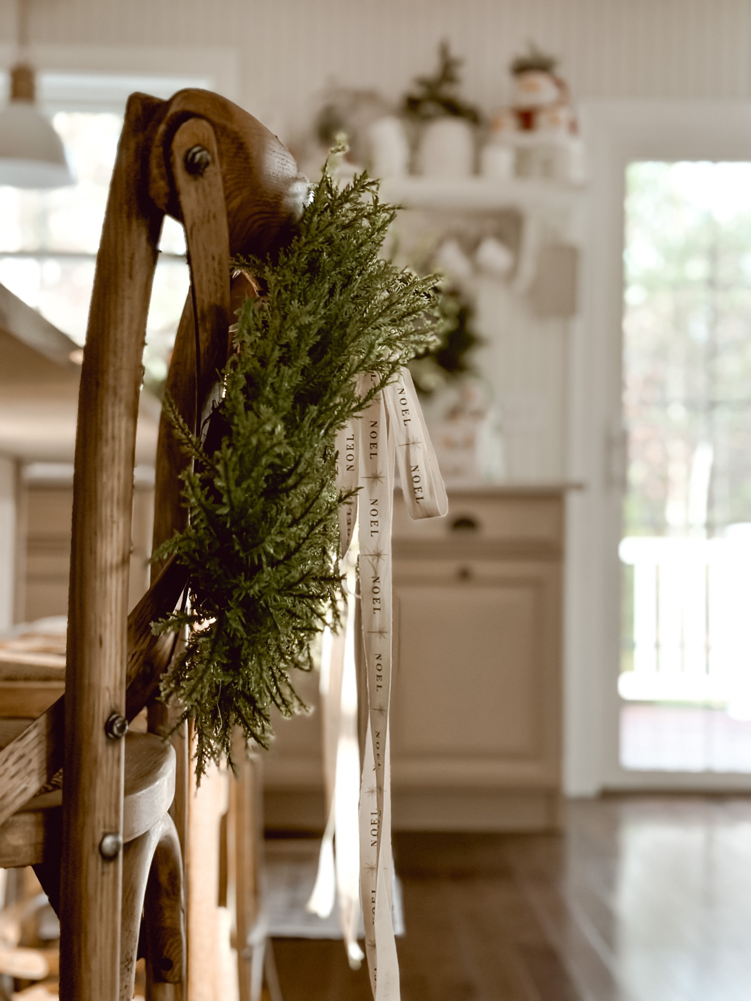 Christmas wreaths on kitchen counter stools. 

#LTKHoliday #LTKSeasonal #LTKhome