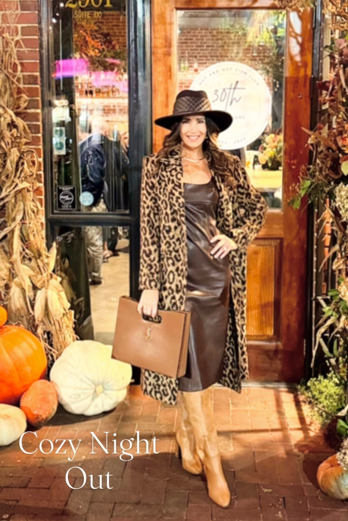 Cozy Fall Night Out in Bham 🍁🍂

Temps fell to freezing for a few days here and had to get cozy for our night out! 

Brown faux leather midi dress along with this chic brown fedora hat with leather quilt details.🤎

Added my Hermes boots with stitching detail. 👢

Love the shape of this bag also along with the brown colors 👜  Gold necklace and large gold tear drop earrings.  Covered up with leopard print wool long coat. 🐆

#fall #cozyoutfit #grwm #hermes #ericjavitts #veganleather #mididress #saintlaurent #fedorahat #leopardcoat #bottegaveneta 

#LTKItBag #LTKOver40 #LTKgrwm