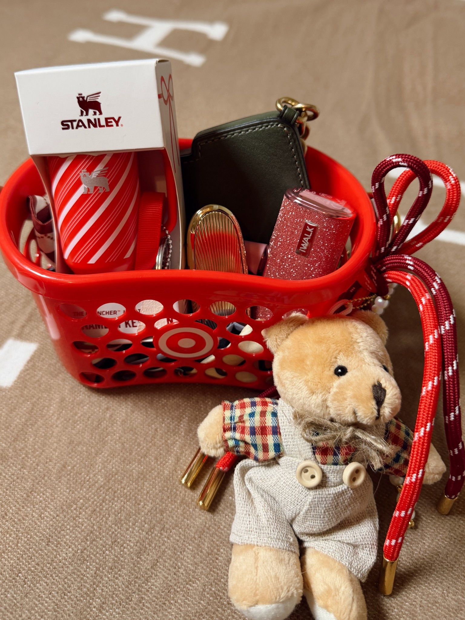 Cute little stocking stuffer or gift with the mini target shopping basket
Mini Christmas Stanley cup ornament 
Coach Christmas tree coin pouch
Little works project teddy bear bag charm
Iwalk glitter portable phone charger
Guerlain customizable lipstick case 

#LTKGiftGuide #LTKHoliday #LTKCyberWeek