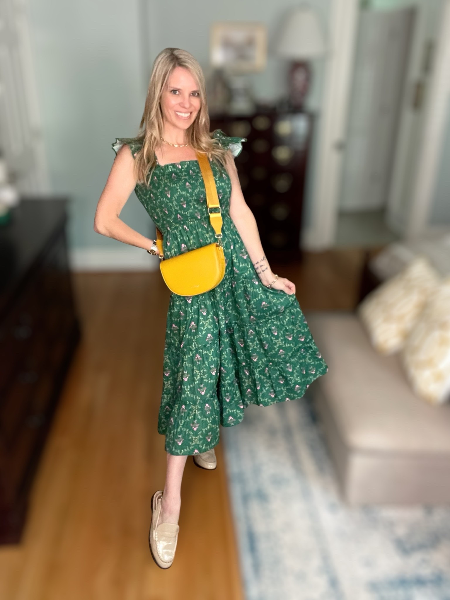 ✨ Hill House lookalike for less! This green floral midi dress has the same smocked bodice and feminine ruffle sleeves we all love about the iconic Ellie Nap Dress, but at a fraction of the price. I paired it with classic gold slingback loafers, a bold yellow crossbody bag, chunky gold hoops, and layered jewelry for an easy transitional outfit that’s perfect for brunch, errands, or casual fall events. 🍂💛

If you’ve been searching for affordable nap dress lookalikes, Amazon green floral midi dresses, or everyday preppy chic outfits, this one checks all the boxes. Style it with loafers for day, switch to block heels for night, and you’ve got a versatile piece you’ll reach for again and again. 🌿

Hill House lookalike, Nap Dress dupe, green floral midi dress, Amazon dresses under $40, preppy fall outfit, ruffle sleeve dress, affordable chic outfit, smocked bodice dress, classic everyday style, feminine transitional look


#LTKFindsUnder50 #LTKShoeCrush #LTKItBag