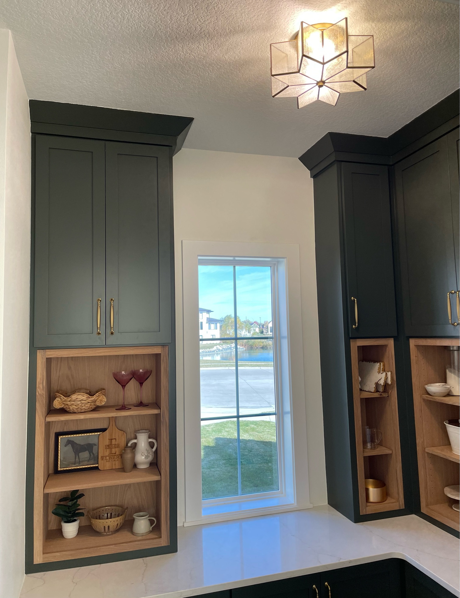 Kitchen Pantry // Top Knobs Hardware in Honey Bronze // Joss & Main Star Flush mount light fixture // 

Paint Color: Ripe Olive 
Floors: The Tile Shop: 8x8 Chalk White, 8x8 Chalk Gray 

Custom Built home // Husk Homes // Home Builders Iowa // 