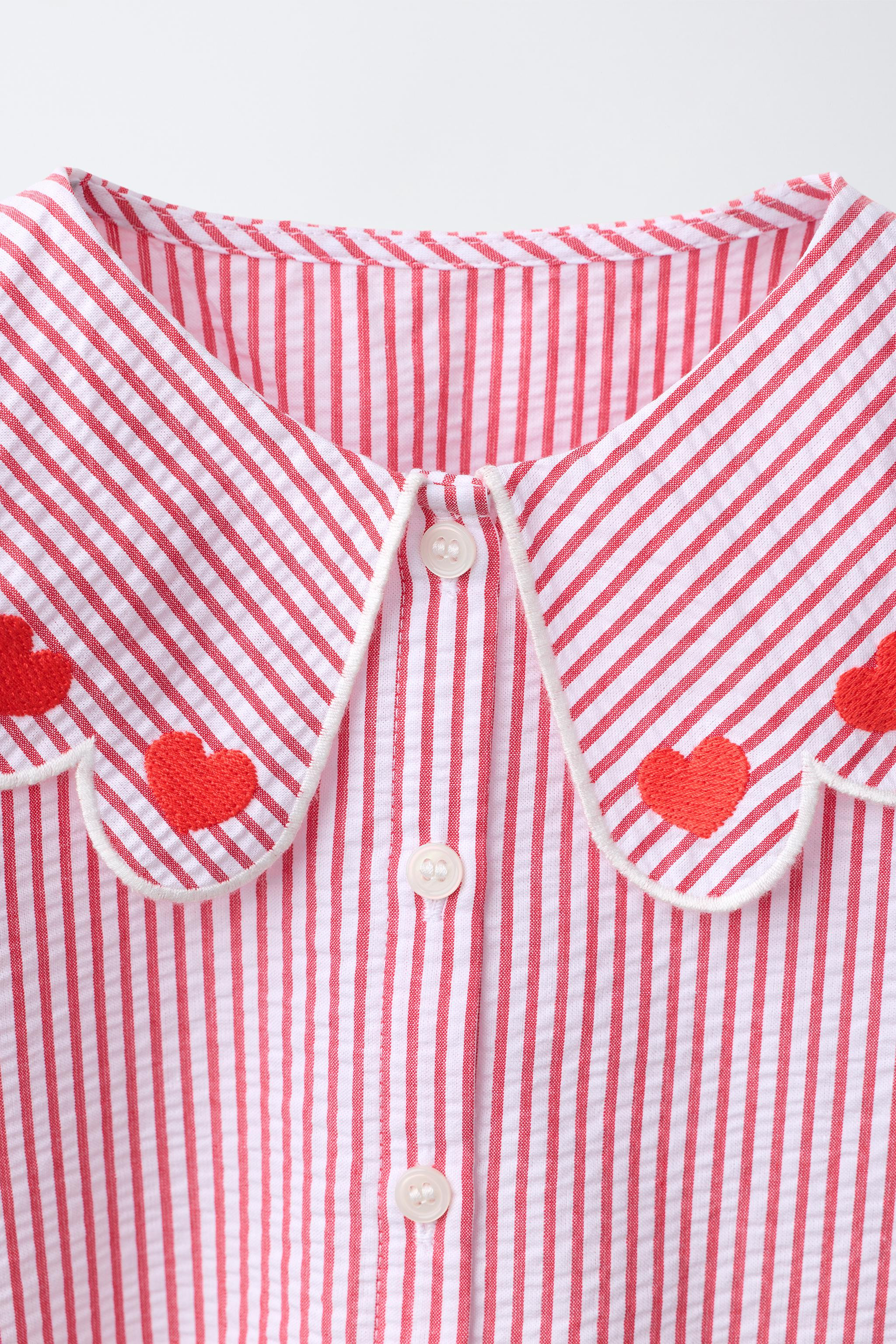 Shirt with a Peter Pan collar featuring embroidered hearts, contrast piping detail and long sleev... | Zara UK