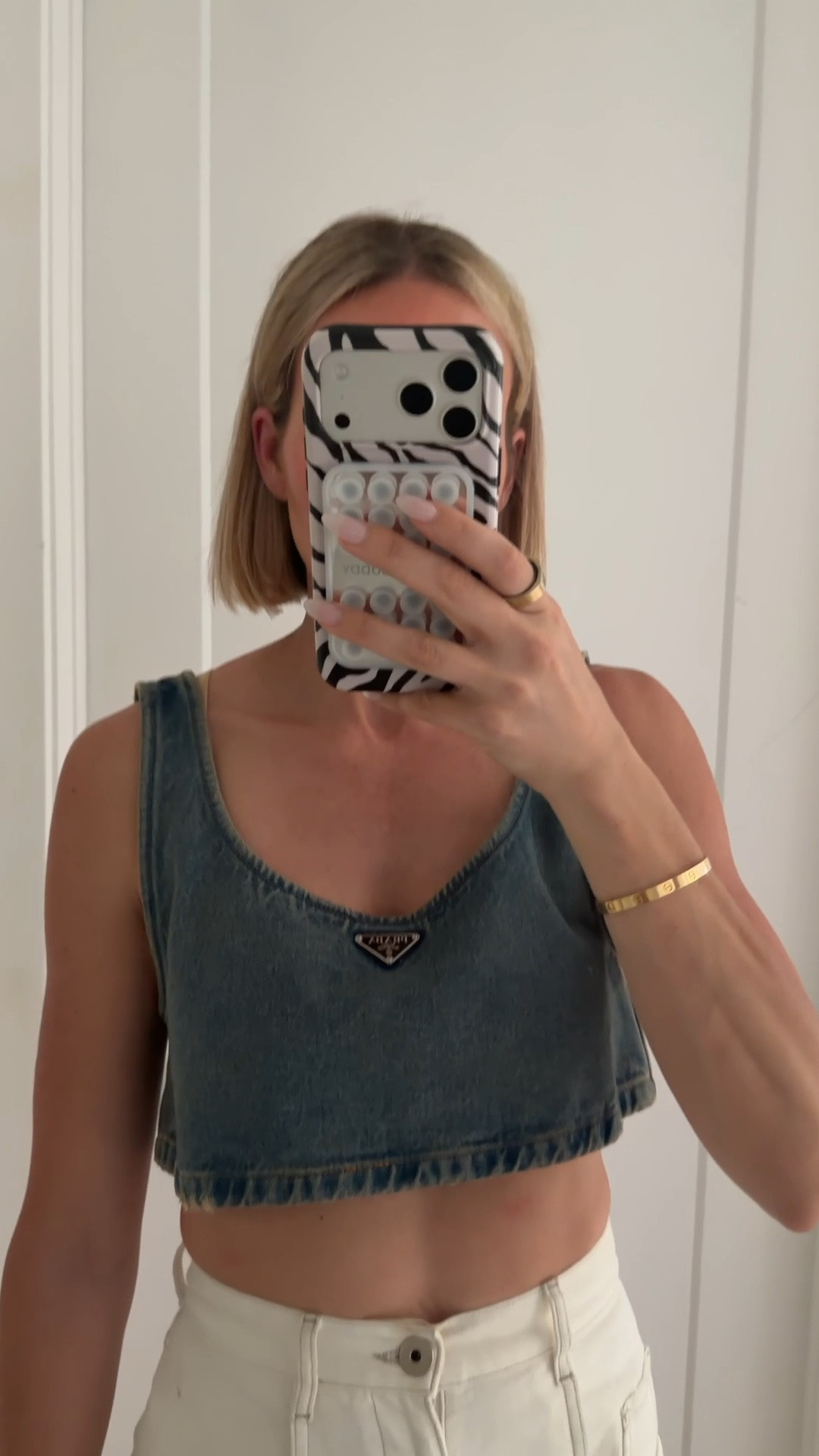 Jeans run tts. Sadly, this Prada top is sold out but the denim one i linked below looks so so similar. Also linked a cropped Prada top that is not denim. ￼

#LTKootd #LTKdayinmylife #LTKOver40