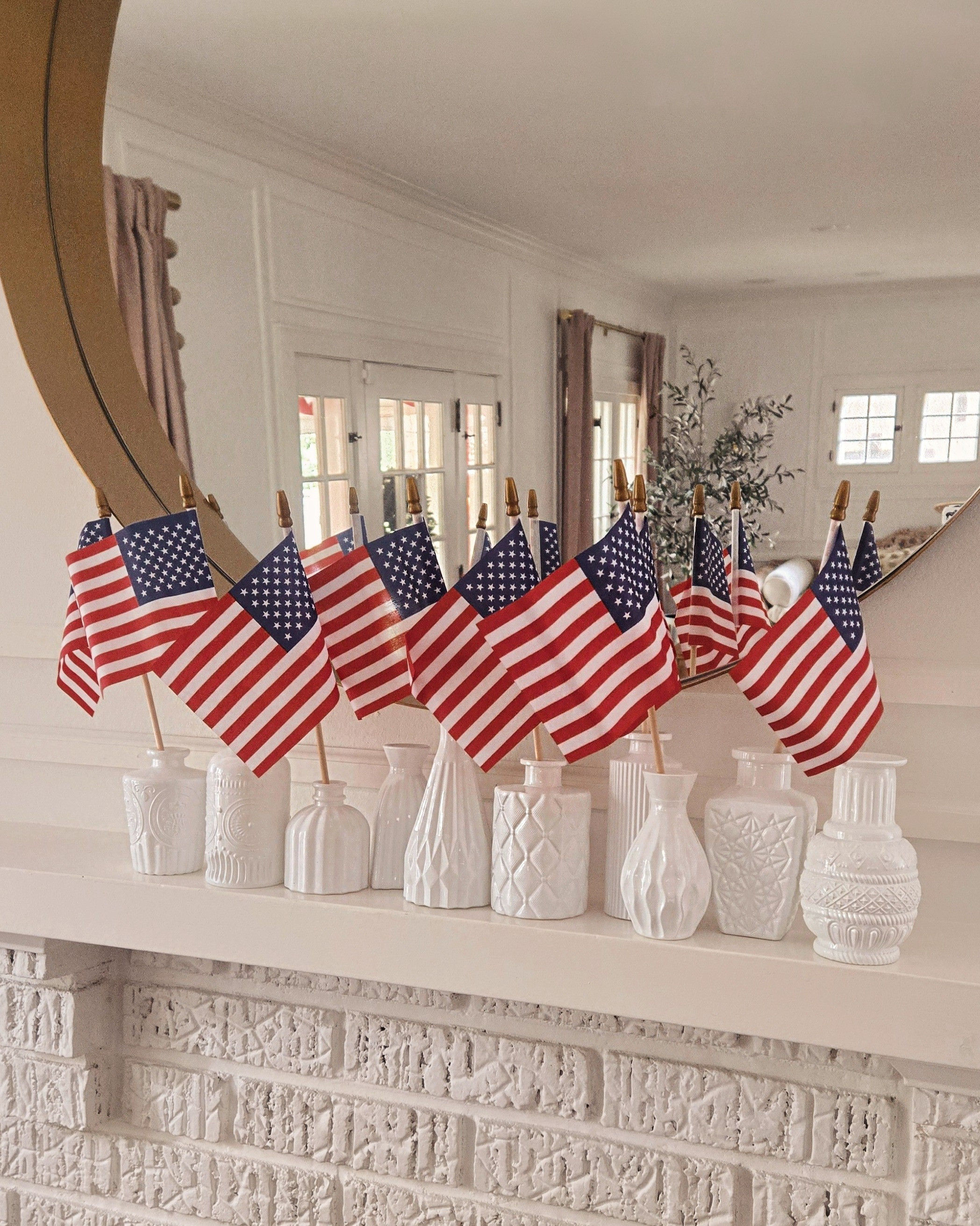 This set of milk glass bud vases has endless uses! Added these little flags for the fourth of July and love their varying heights. 

#LTKParties #LTKHome