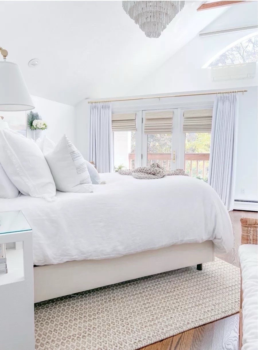 Our coastal primary bedroom! 
- 
coastal home decor, coastal bedroom decor, coastal bedroom furniture, serena & lily pillow covers, blue & white pillow covers, beach house bedroom, beach house decor, beach house furniture, bedroom ideas, neutral bedroom decor, white nightstands, coastal nightstands, serena & lily wall sconces, white duvet cover, linen duvet cover, white bedding, pottery barn bedding, coastal bedding, bedroom rugs, neutral rugs, 8x10 rugs, 9x12 rugs, coastal rugs, beach house rugs, beach house bedroom, master bedroom decor, bedroom furniture, linen bedding, upholstered bed, tilly bed, wayfair bed, amazon drapes, amazon curtains, woven shades, woven blinds, white drapes, white curtains, gold hardware, gold curtain rod, coastal chandelier, white beaded chandelier, waterfall chandelier, statement light, rattan bench

#LTKFindsUnder50 #LTKHome #LTKFindsUnder100