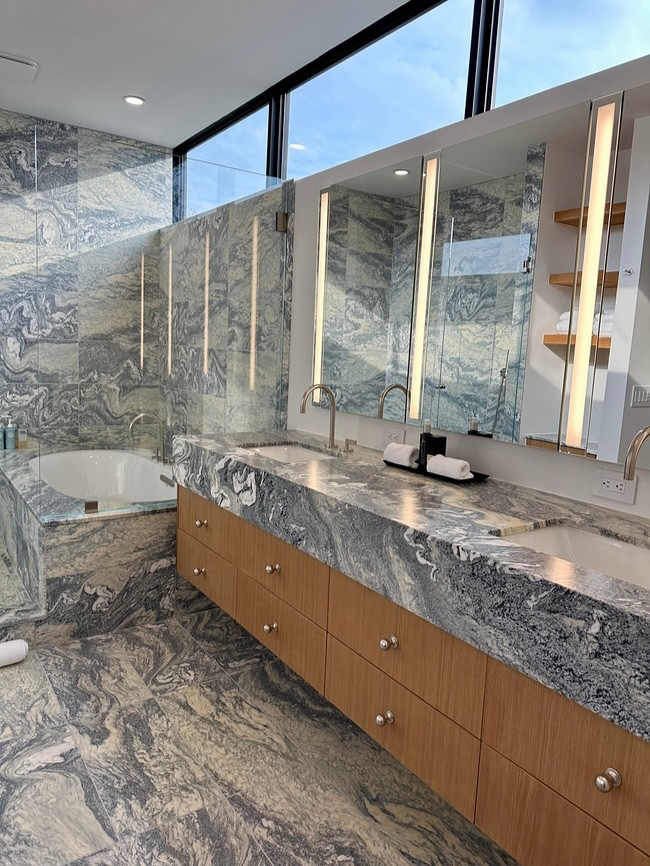 Serenity in blue💎 

A stunning marble bathroom bathed in natural light — now perfectly organized for everyday ease.