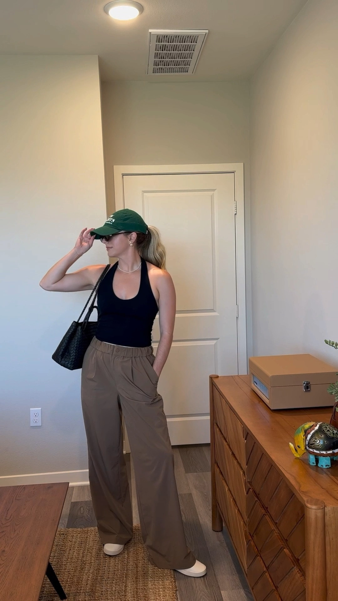 Hella chic, comfy transitional fall outfit •• varley trousers + zara halter + quince bag + sneakers + miu miu sunglasses 🤌🏻

#LTKStyleTip #LTKItBag #LTKSeasonal