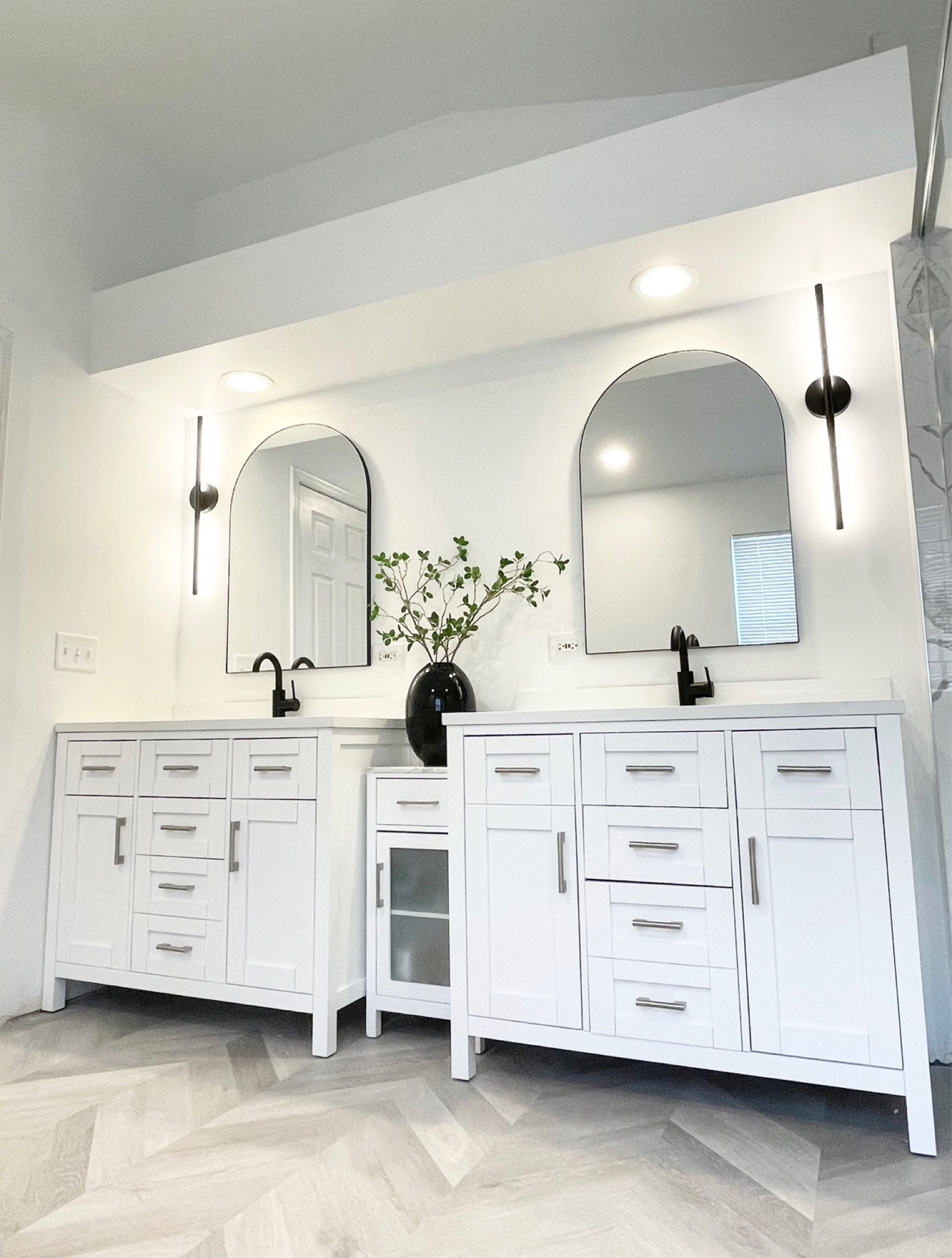 Modern Bathroom 
Vanity Mirrors Arch
Modern Light Fixture
Light sconce
Flooring 
Home decor 

#LTKhome #LTKstyletip #LTKunder100