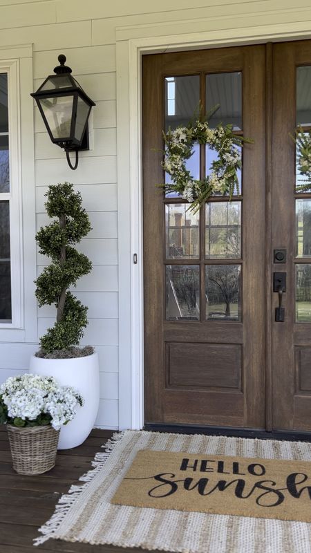 Spring and summer front porch inspiration inspo front door decor southern farmhouse transitional French country modern style double layered doormat jute rug custom wall lighting outdoor lantern planter basket spiral topiary boxwood faux artificial flowers and trees geraniums hydrangea stems large oversized white planter target Amazon Etsy pottery barn overstock

#LTKhome #LTKSeasonal #LTKFind
