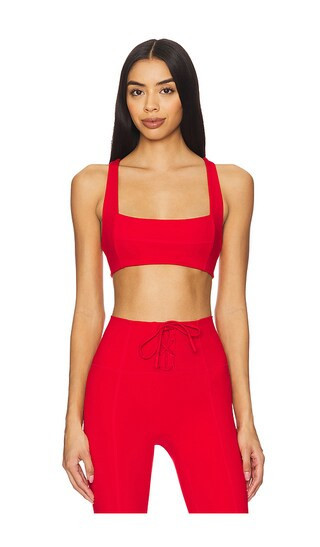 LSPACE Uppercut Sports Bra in Red. - size L | Revolve Clothing (Global)
