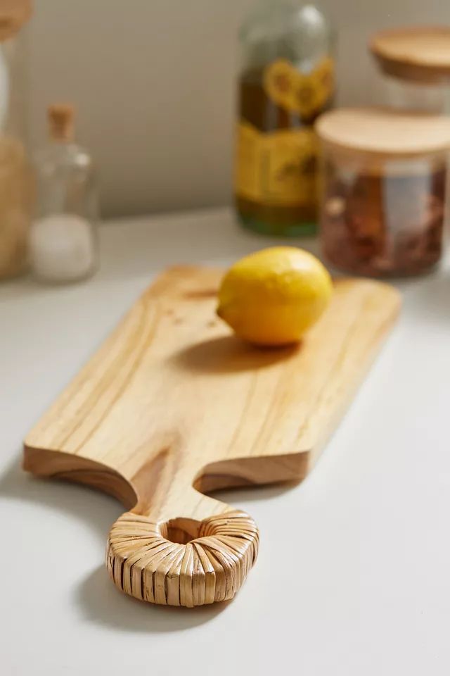 Rattan-Wrapped Teak Wood Serving Board | Urban Outfitters (US and RoW)