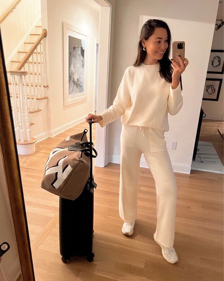 Kat Jamieson of With Love From Kat wears a jogger set. Travel style, cozy, neutral, sweatpants, carry on luggage, duffle bag. 

#LTKstyletip #LTKSeasonal #LTKtravel