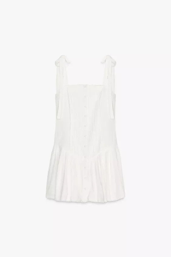 Short dress made of 13% linen. Straight neckline and tie straps. Gathered and pleated details. Ma... | Zara US