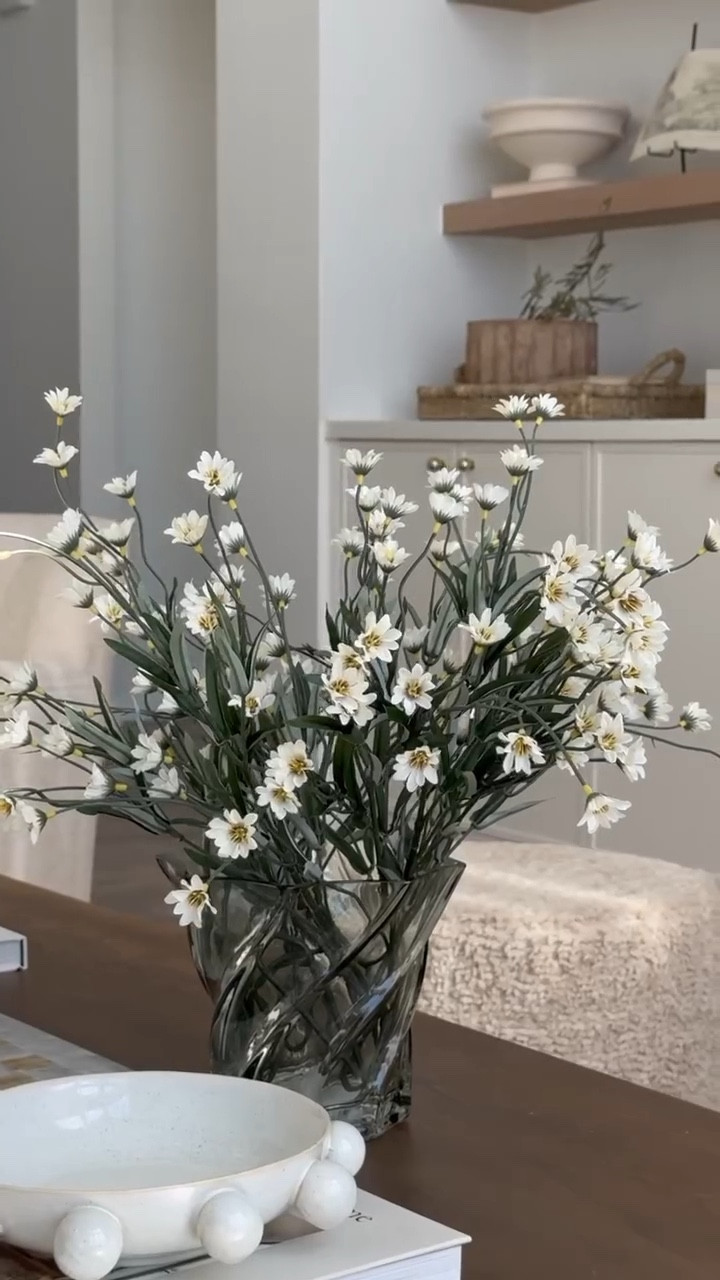 These faux daisy stems are $2.36 each with 20% off, and I love how they bring a soft, natural touch to any space. 

#LTKFindsUnder50 #LTKSaleAlert #LTKHome