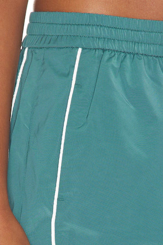 Good American The Sport Skort in Green. - size XS | Revolve Clothing (Global)